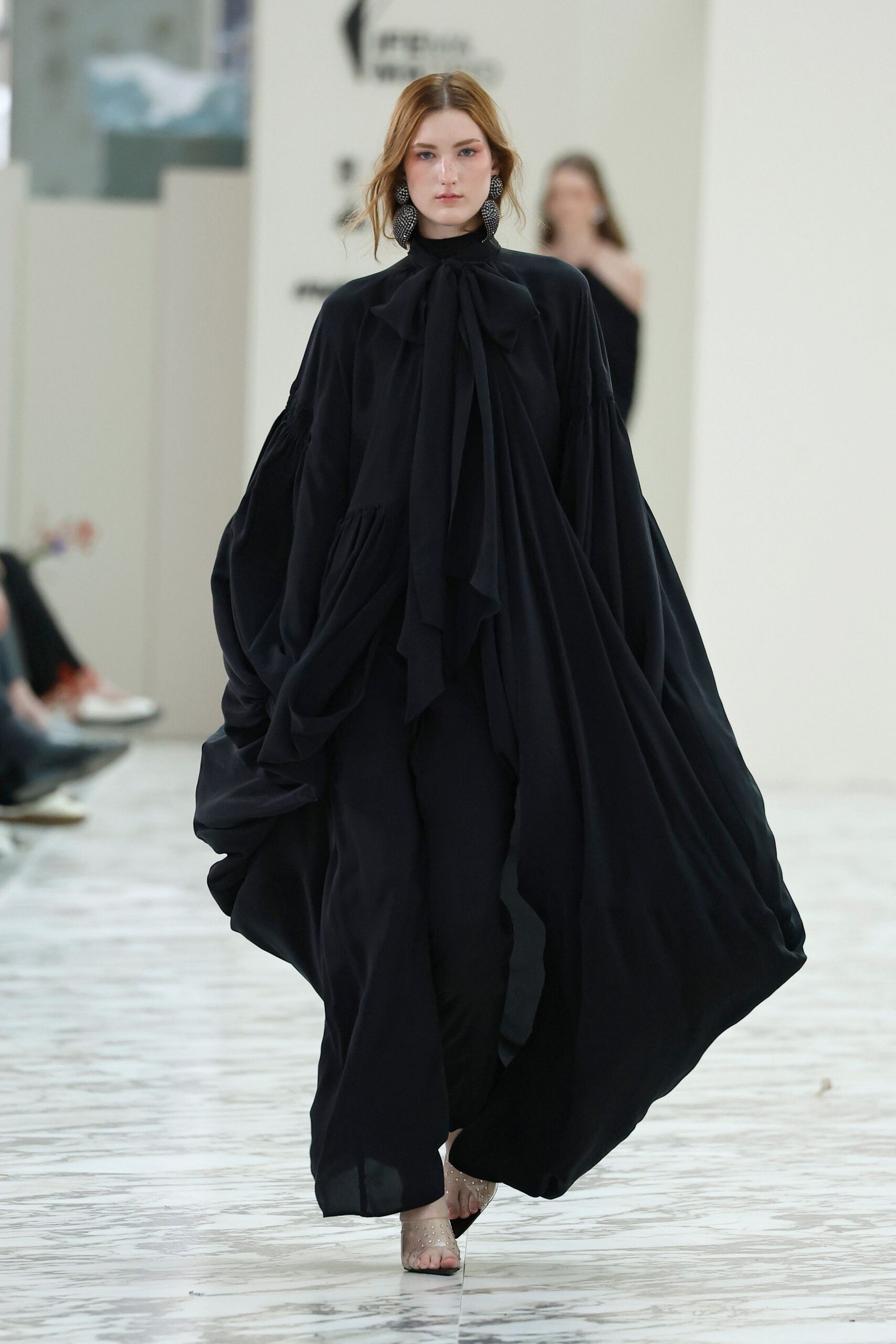 black silk long-sleeve high-neck relaxed draped flowing gown
