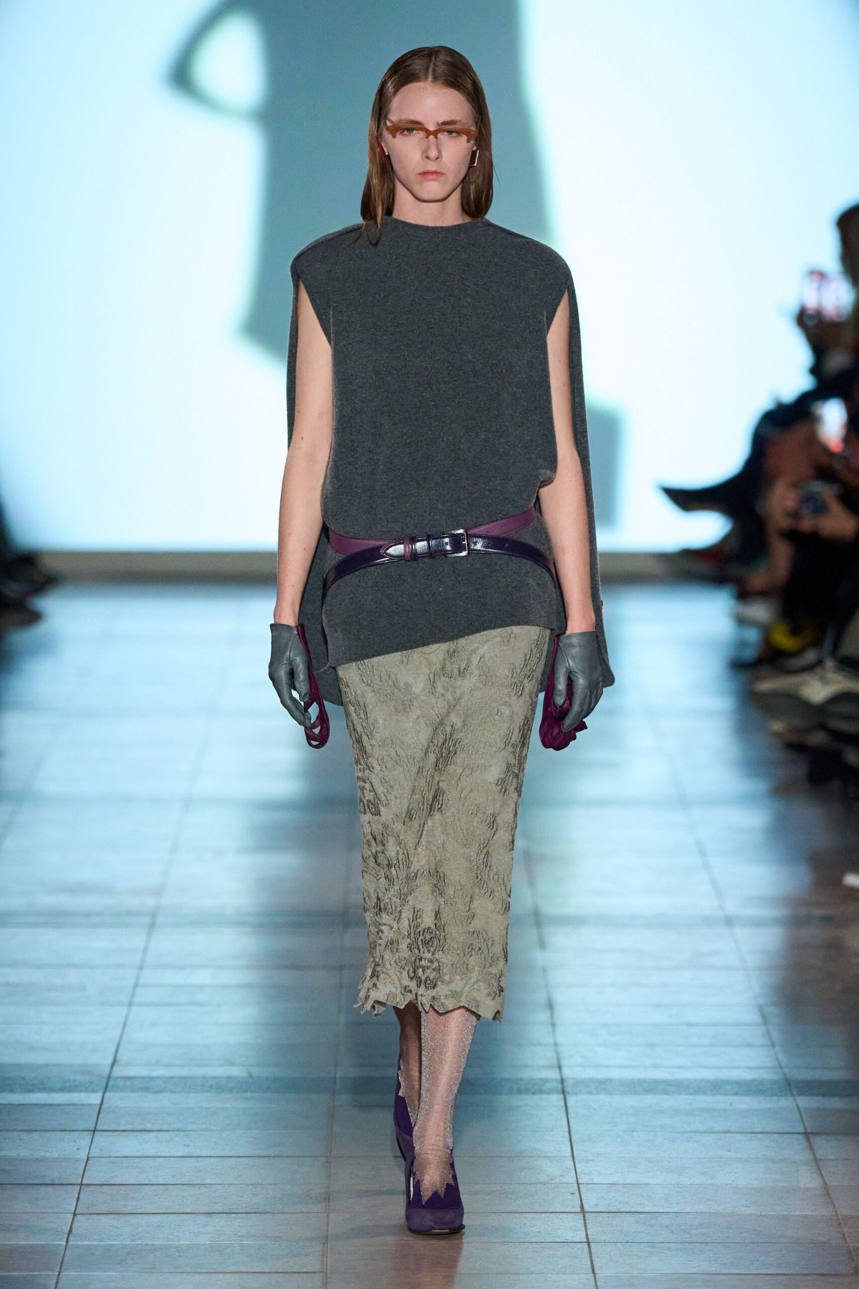 gray wool sleeveless top with green flared skirt