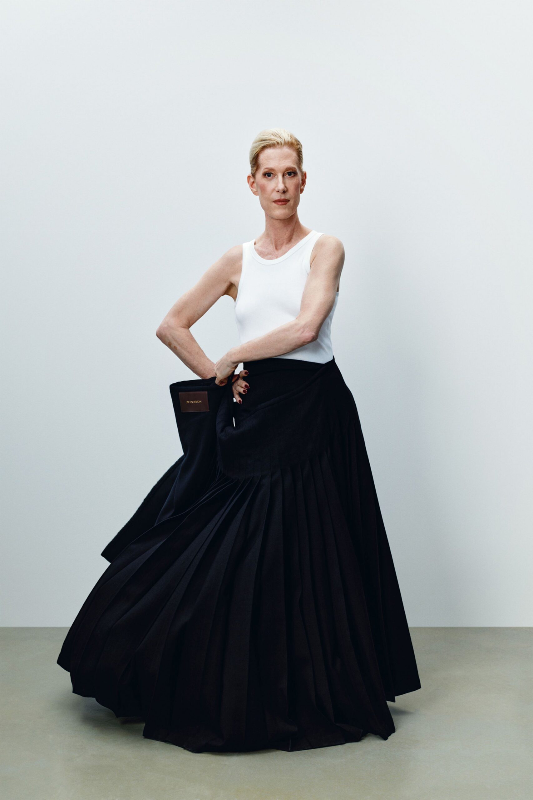 black cotton long-sleeve fitted pleated flowing maxi skirt