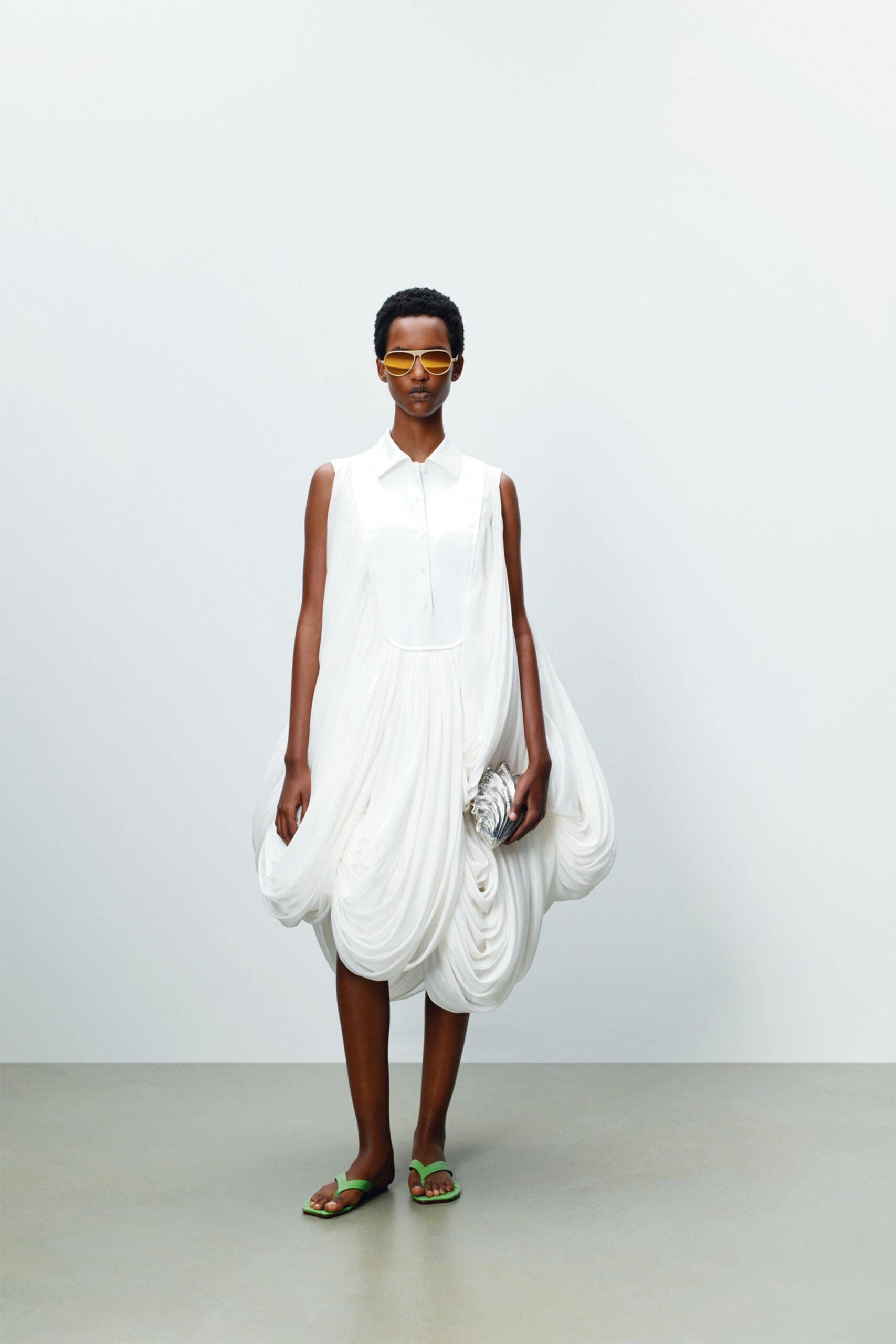 white silk sleeveless collared relaxed draped flowing dress