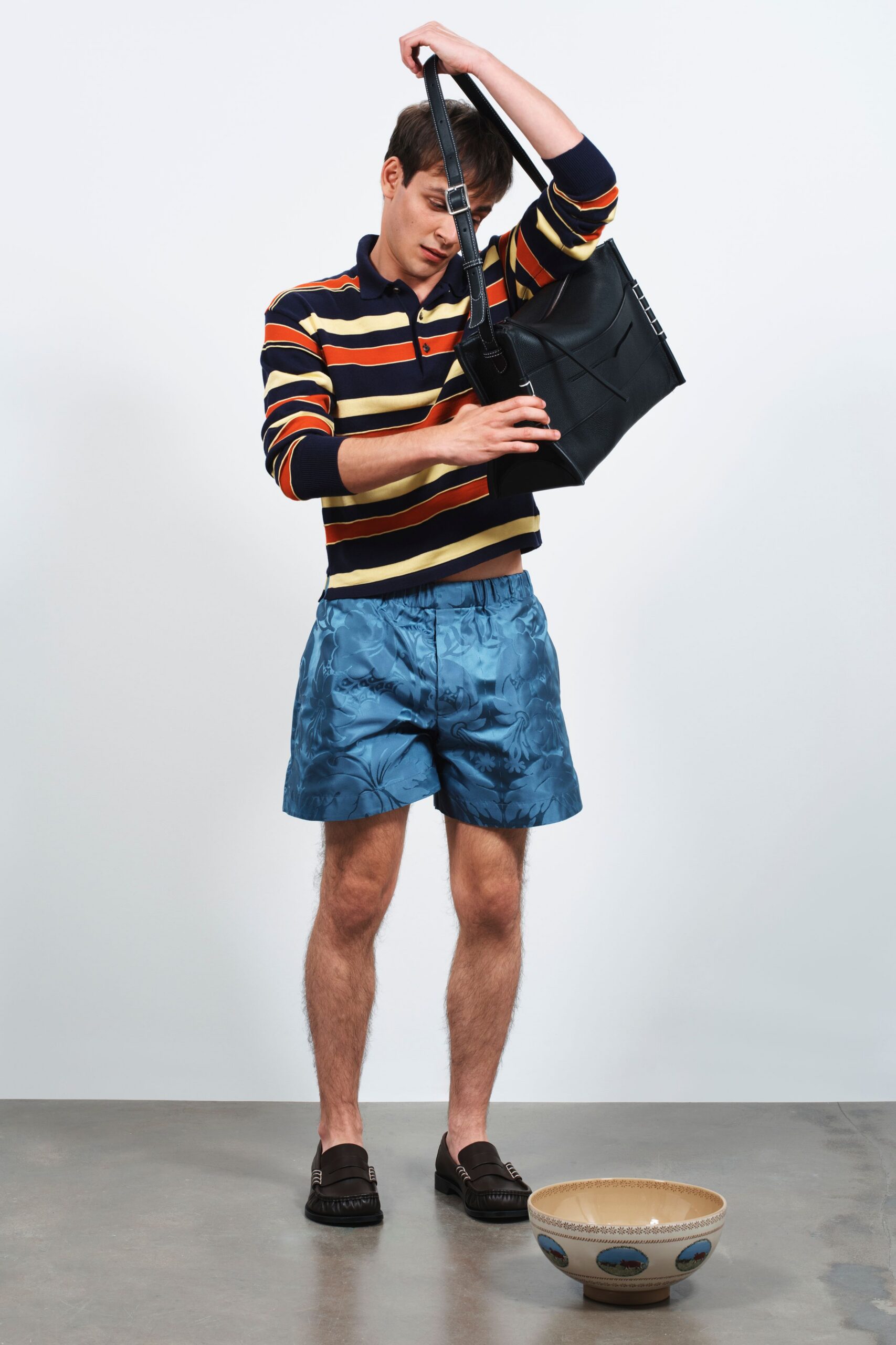 striped shirt and blue shorts