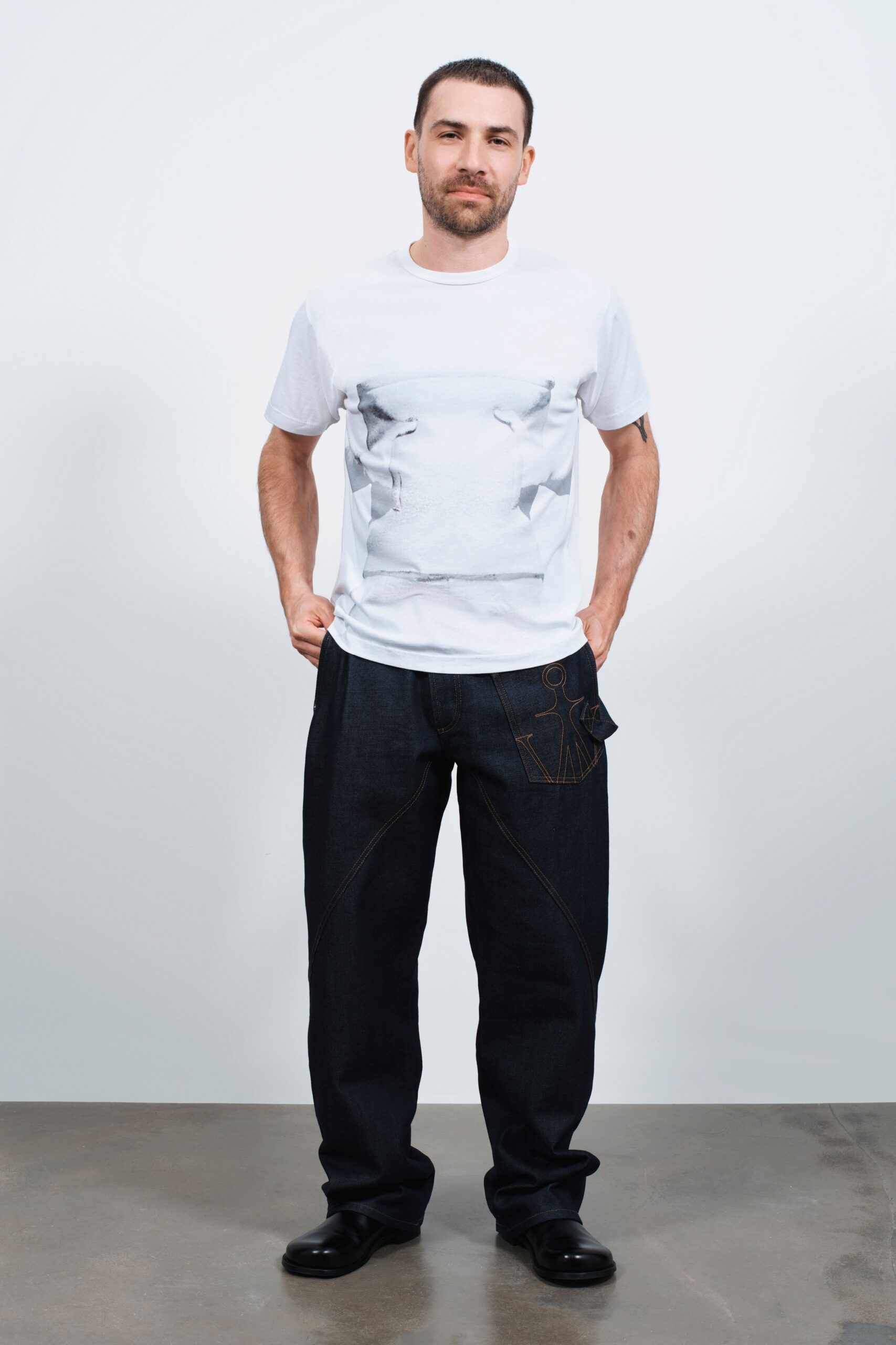 white t-shirt blue pants black shoes