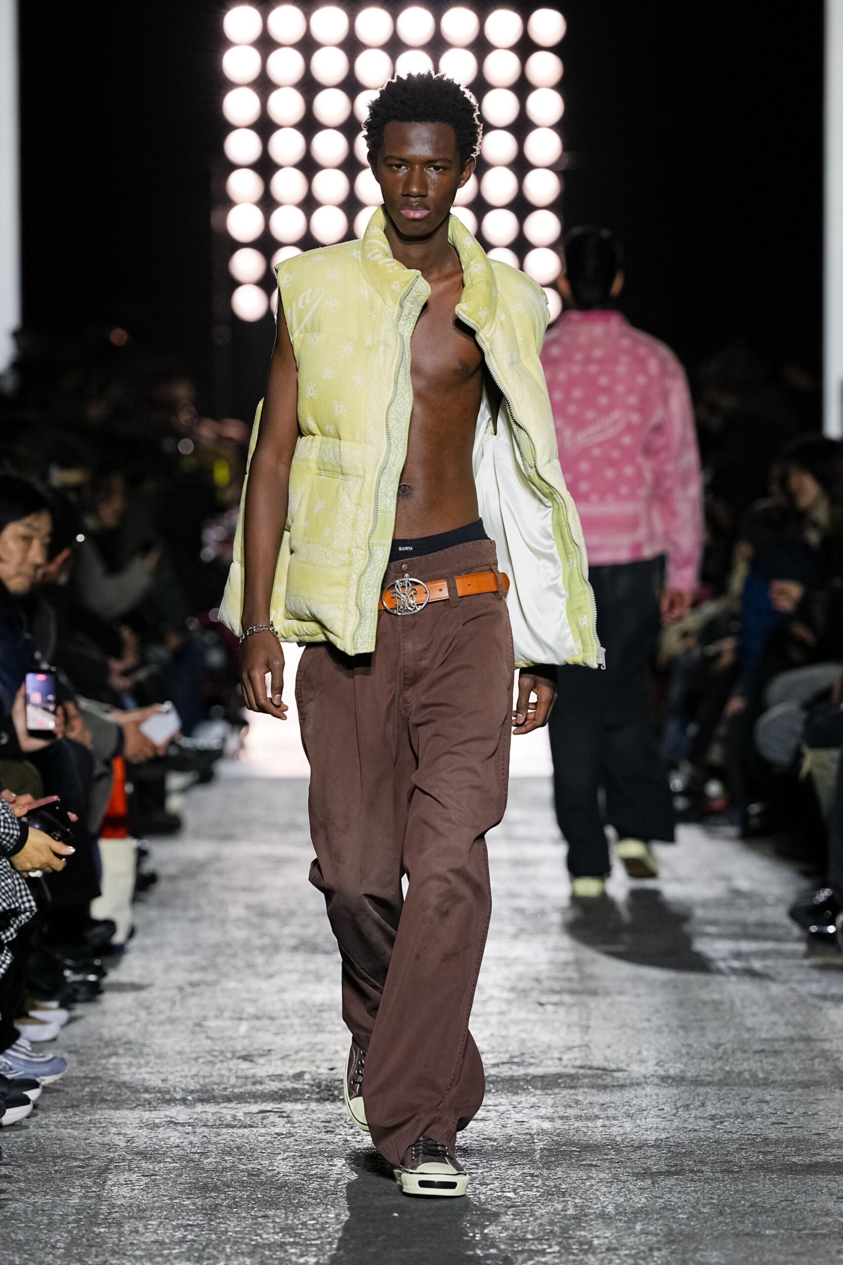 yellow cotton vest with brown pants