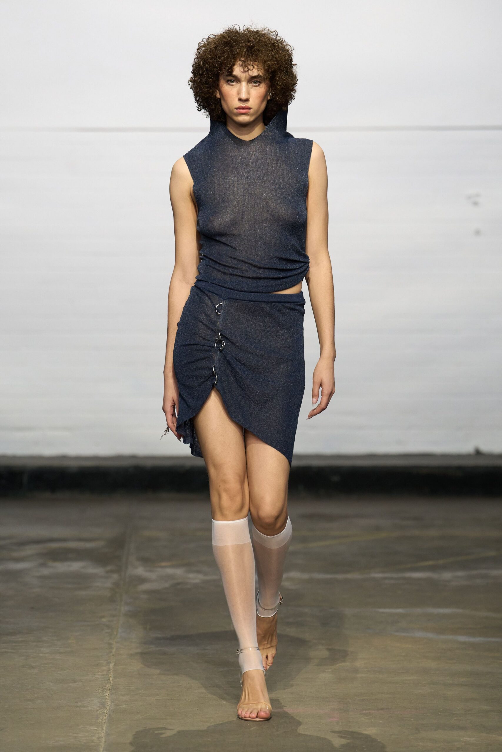 blue denim sleeveless high-neck fitted draped top