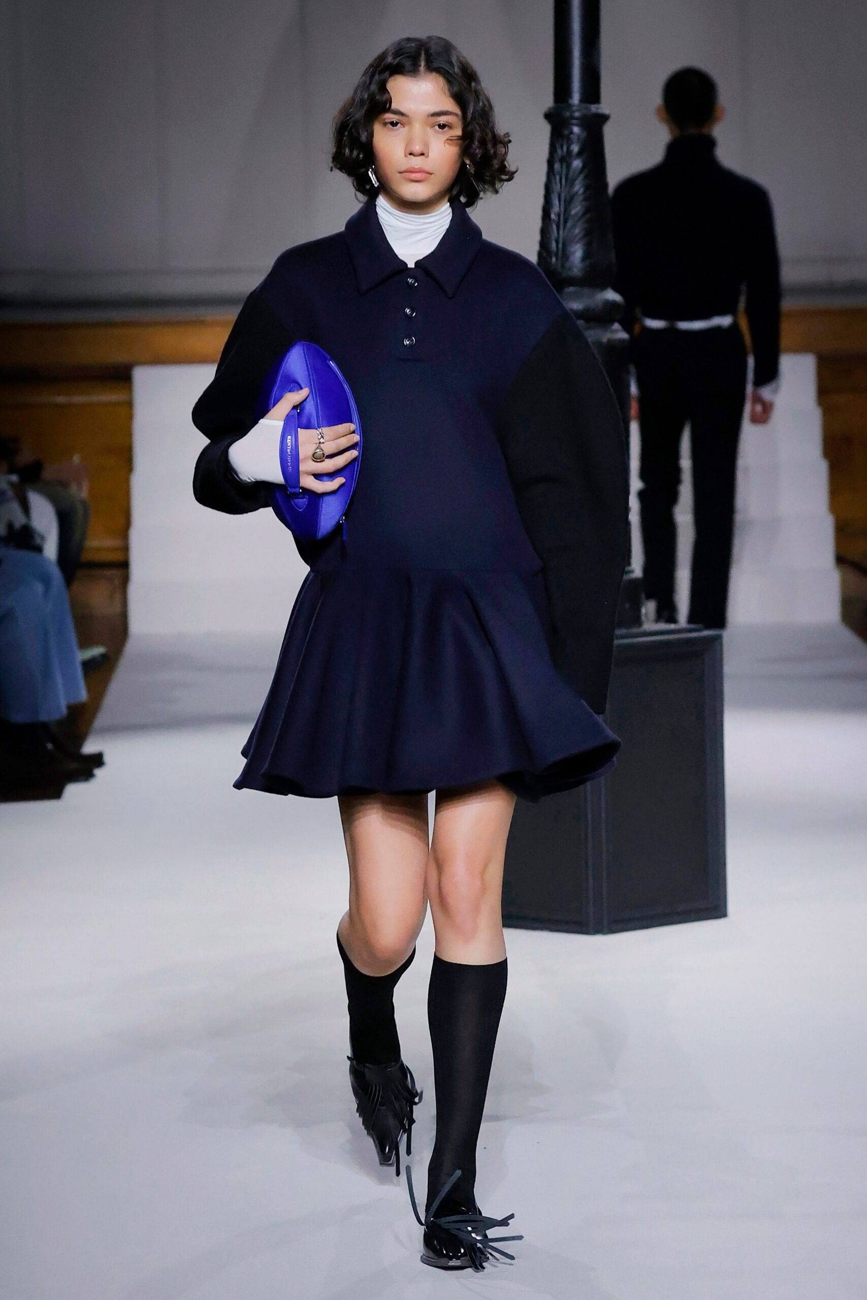 navy pleated mini dress with fringed shoes