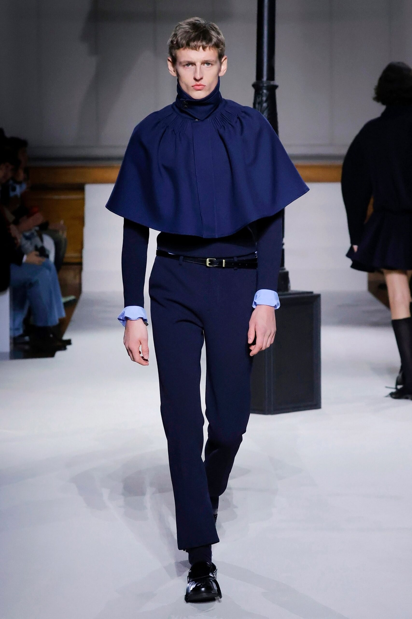 blue sleeveless high-neck fitted cape