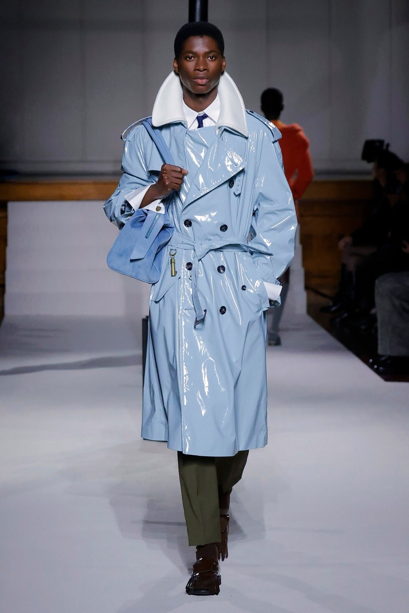 blue vinyl long-sleeve collared structured zippered buttoned trench