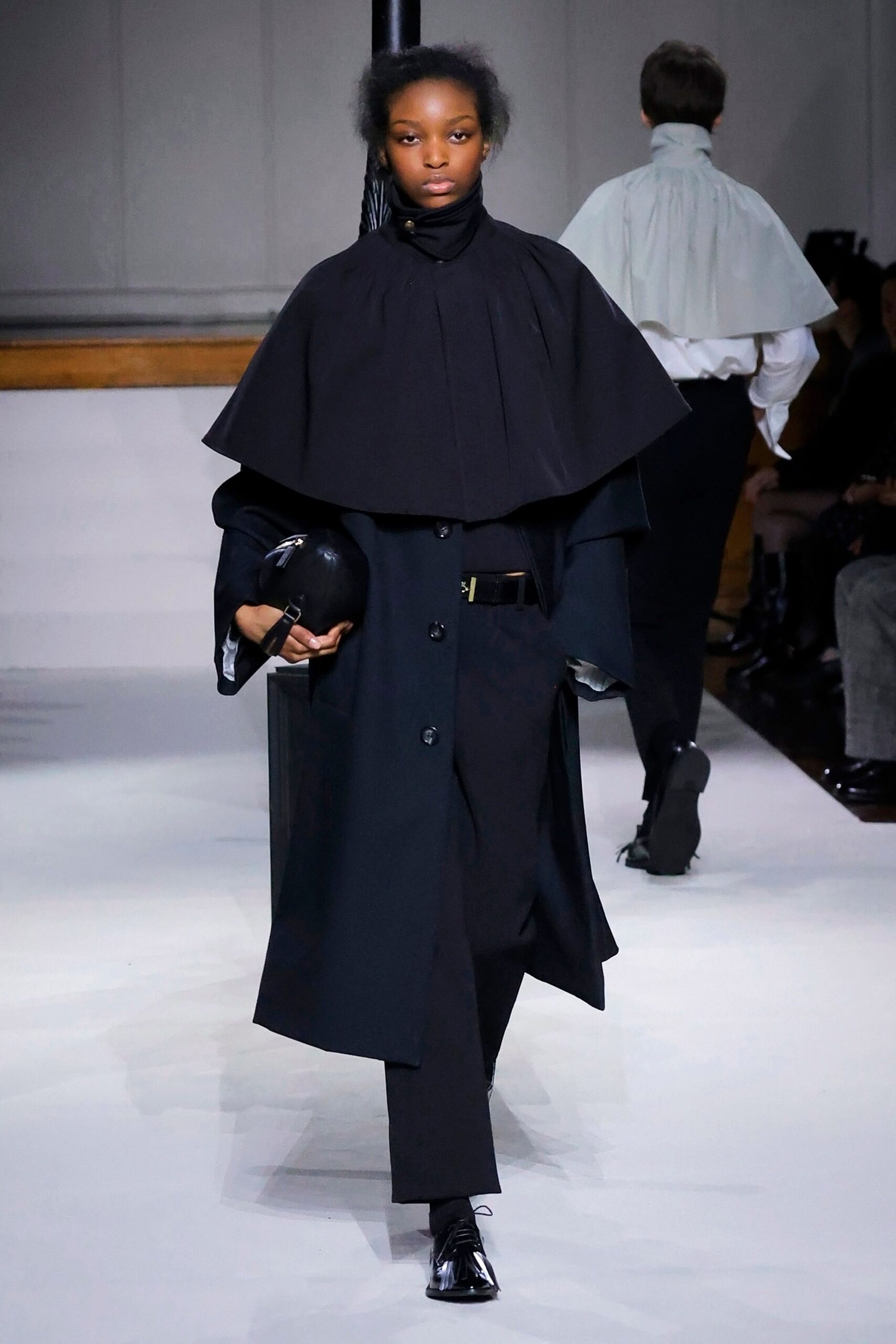 black wool long-sleeve collared oversized layered coat