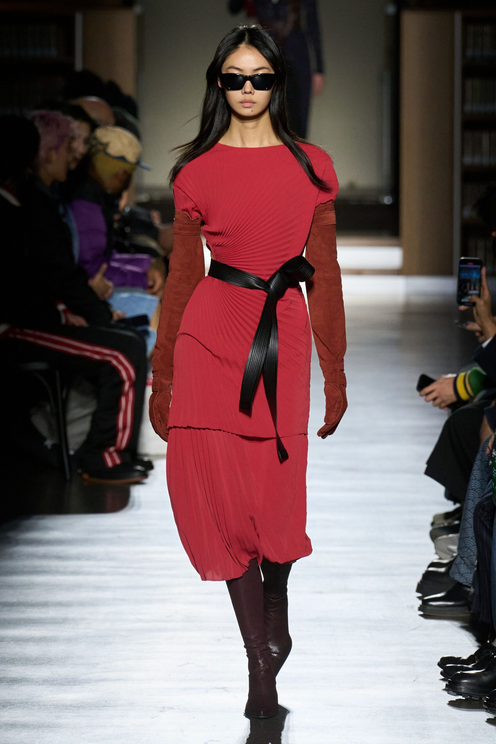 red silk long-sleeve v-neck fitted pleated belted dress