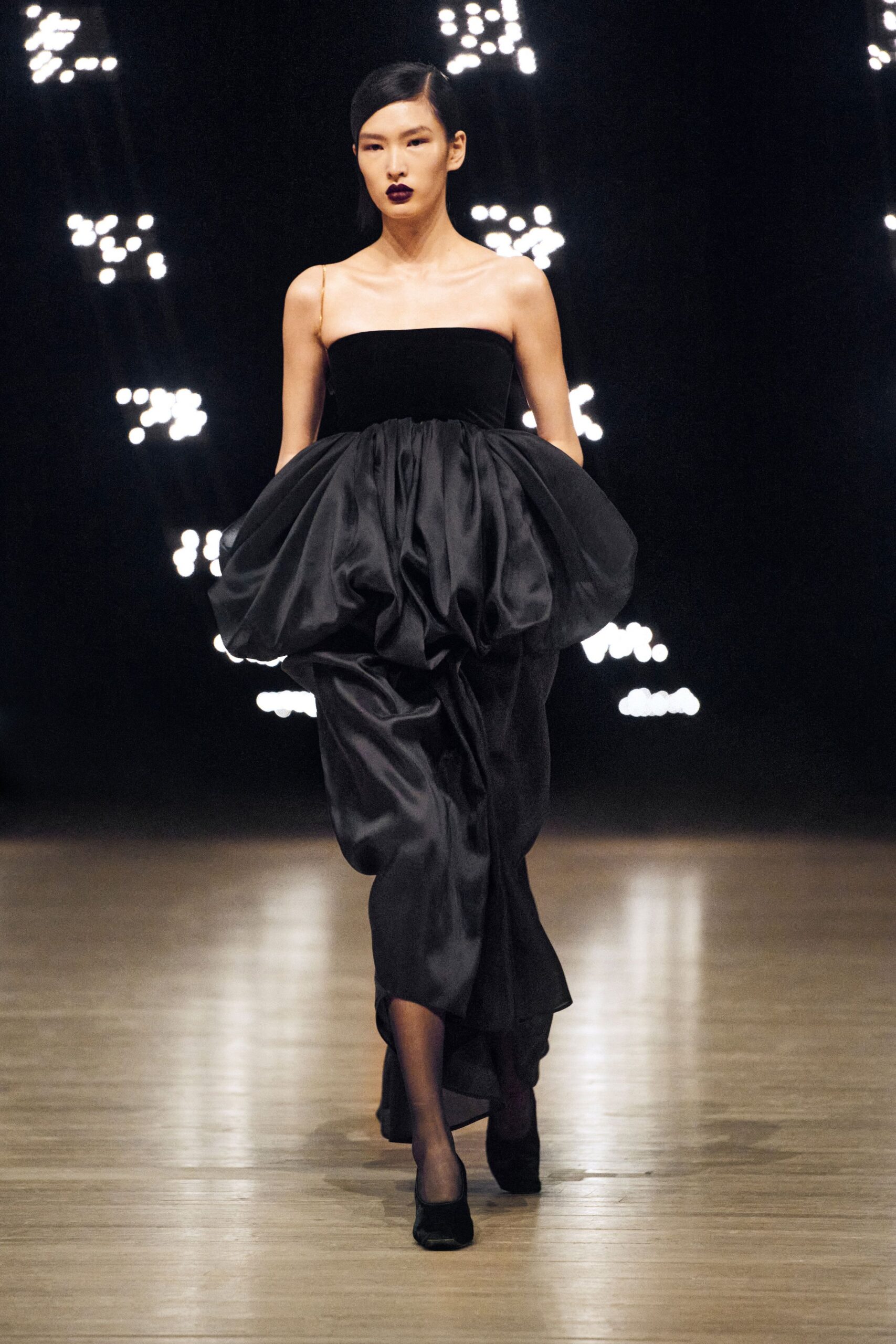 black silk sleeveless strapless fitted pleated layered gown
