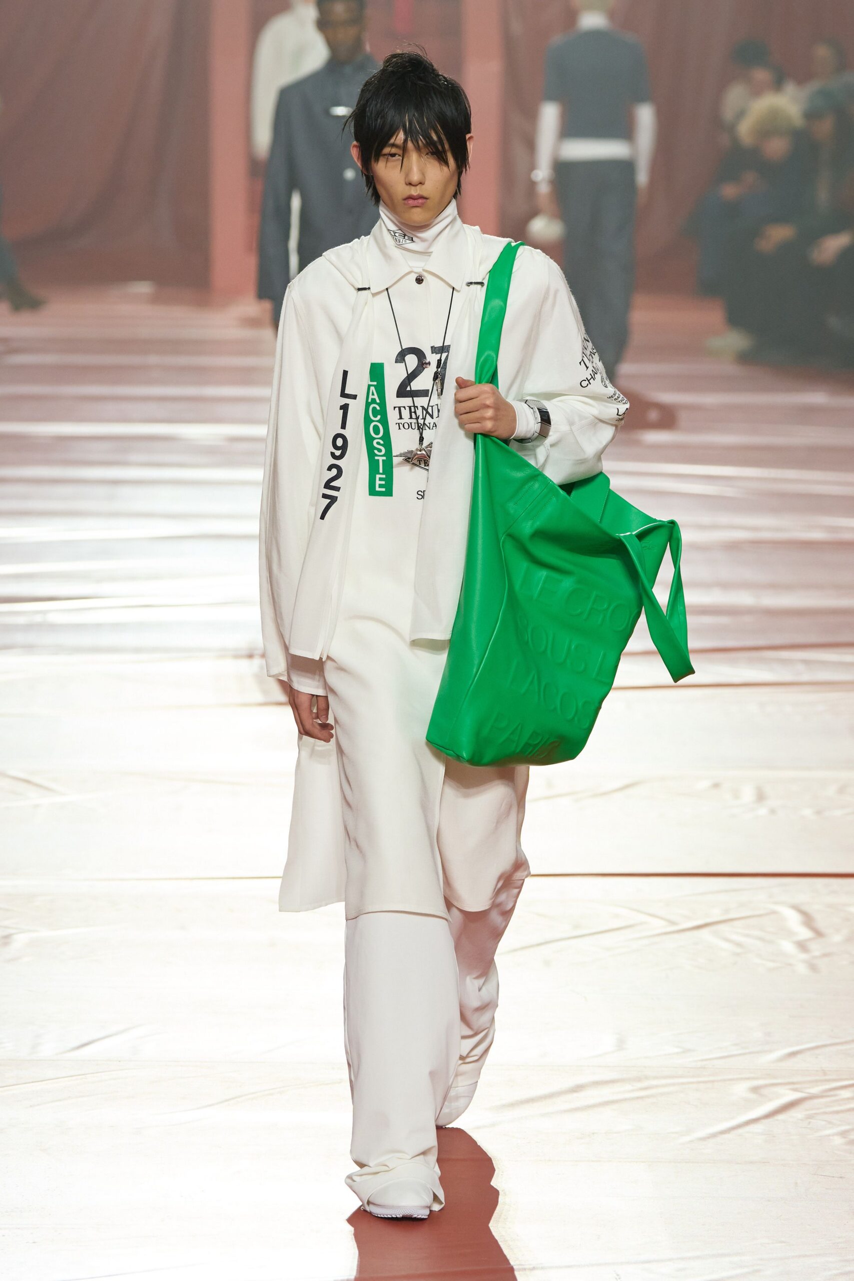 white coat and green bag