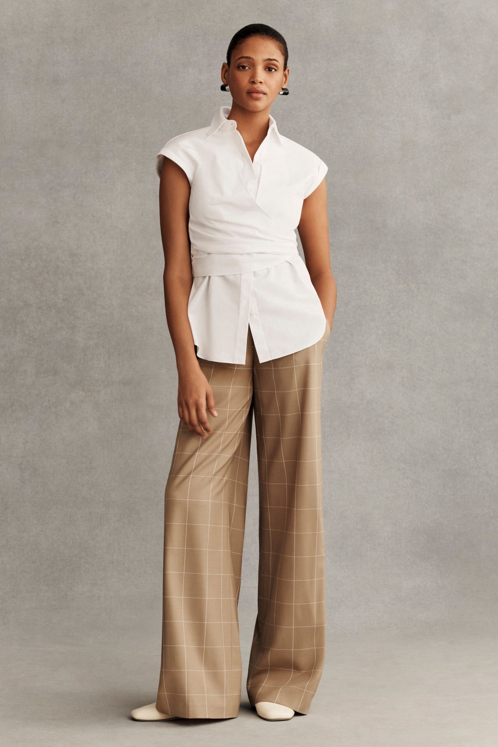 white fitted shirt beige wide-leg pants