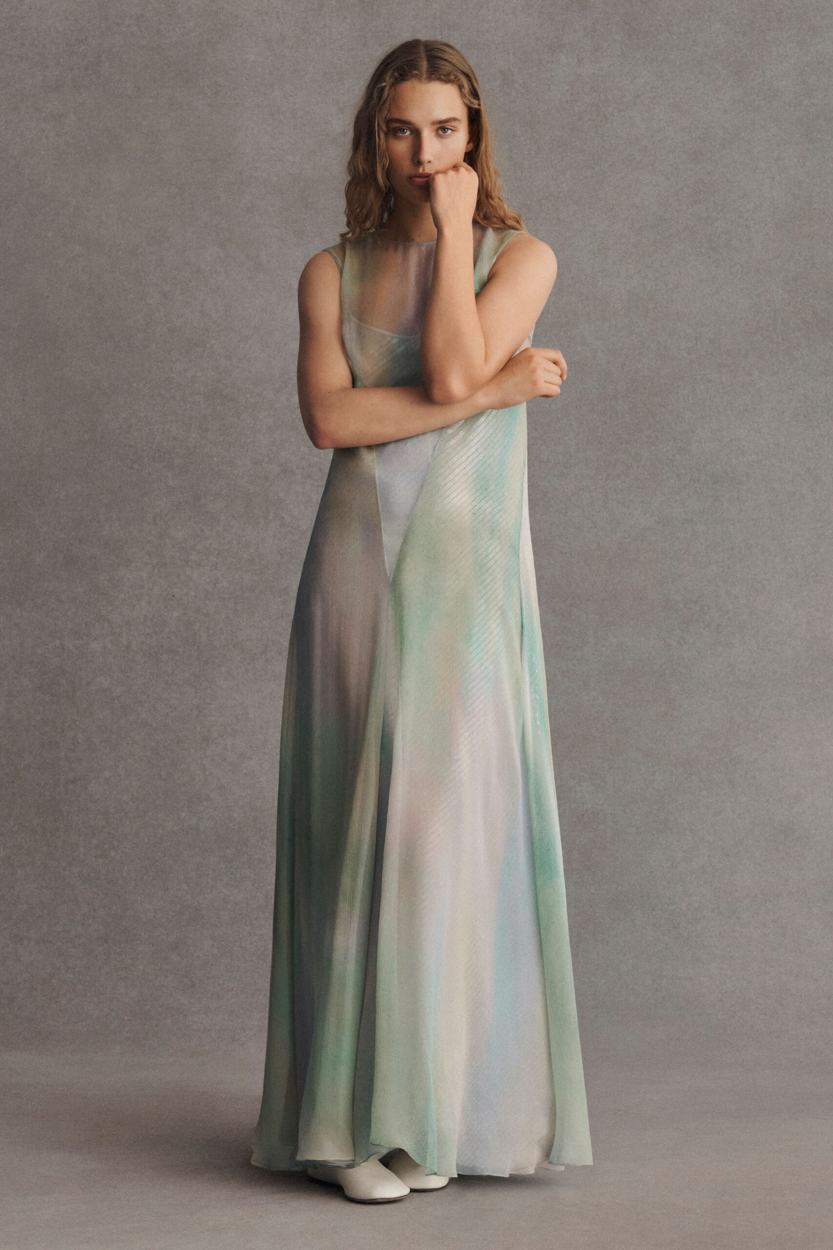 green silk sleeveless high-neck relaxed draped flowing gown