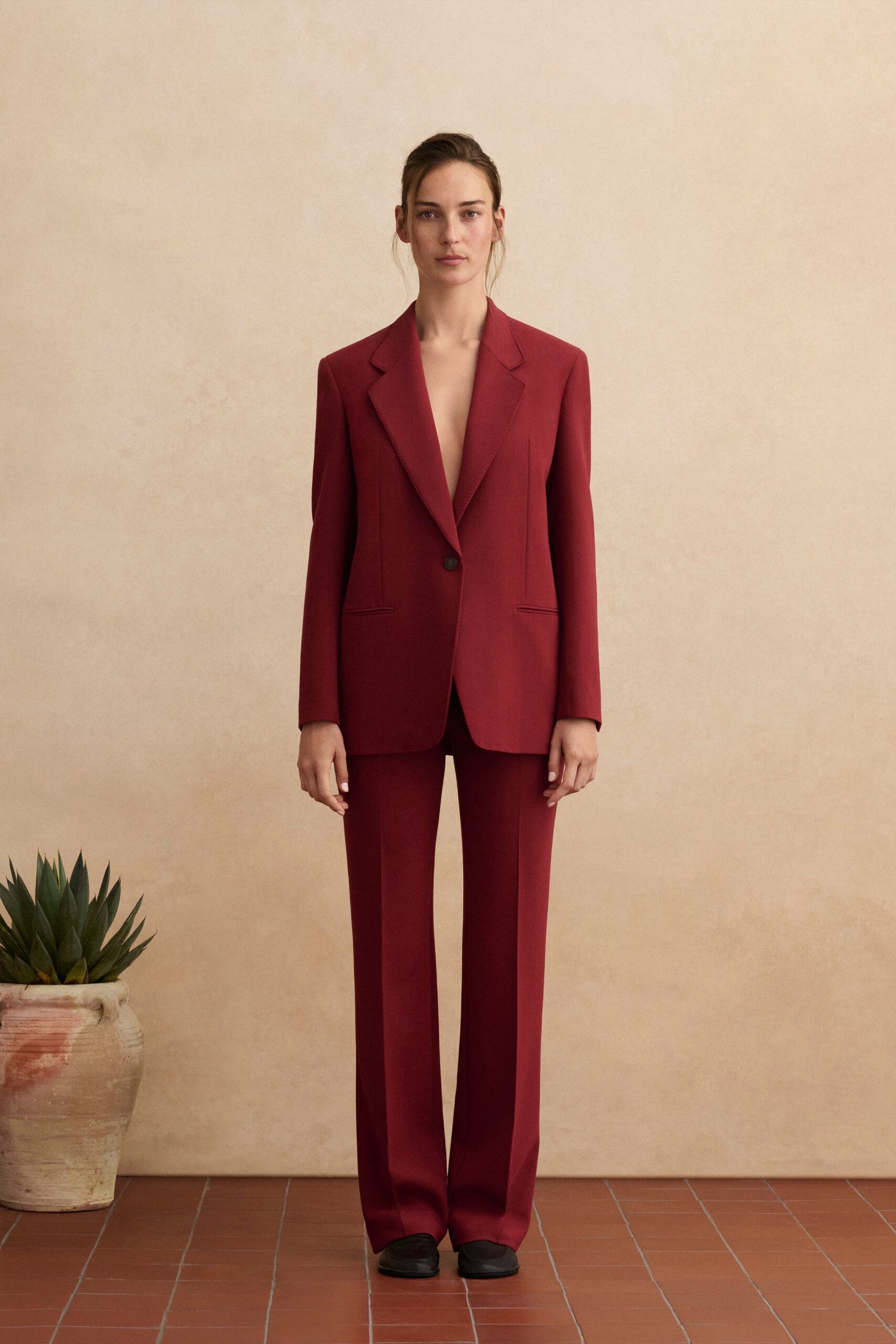 red long-sleeve collared tailored suit