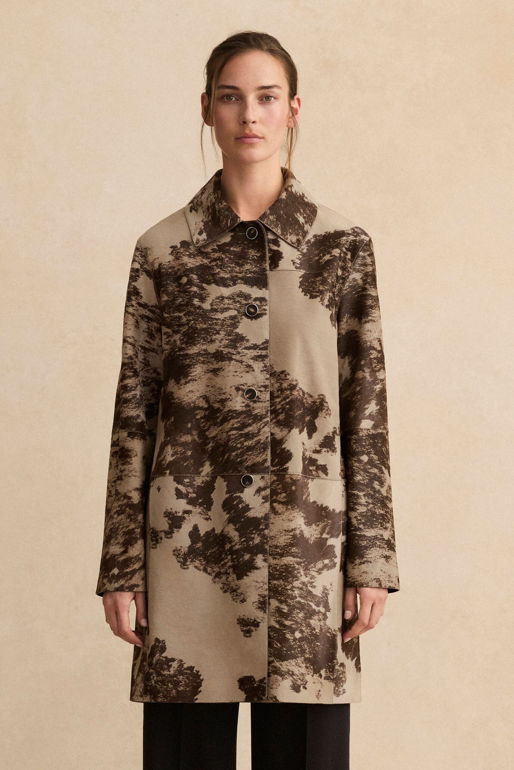 beige and brown printed coat