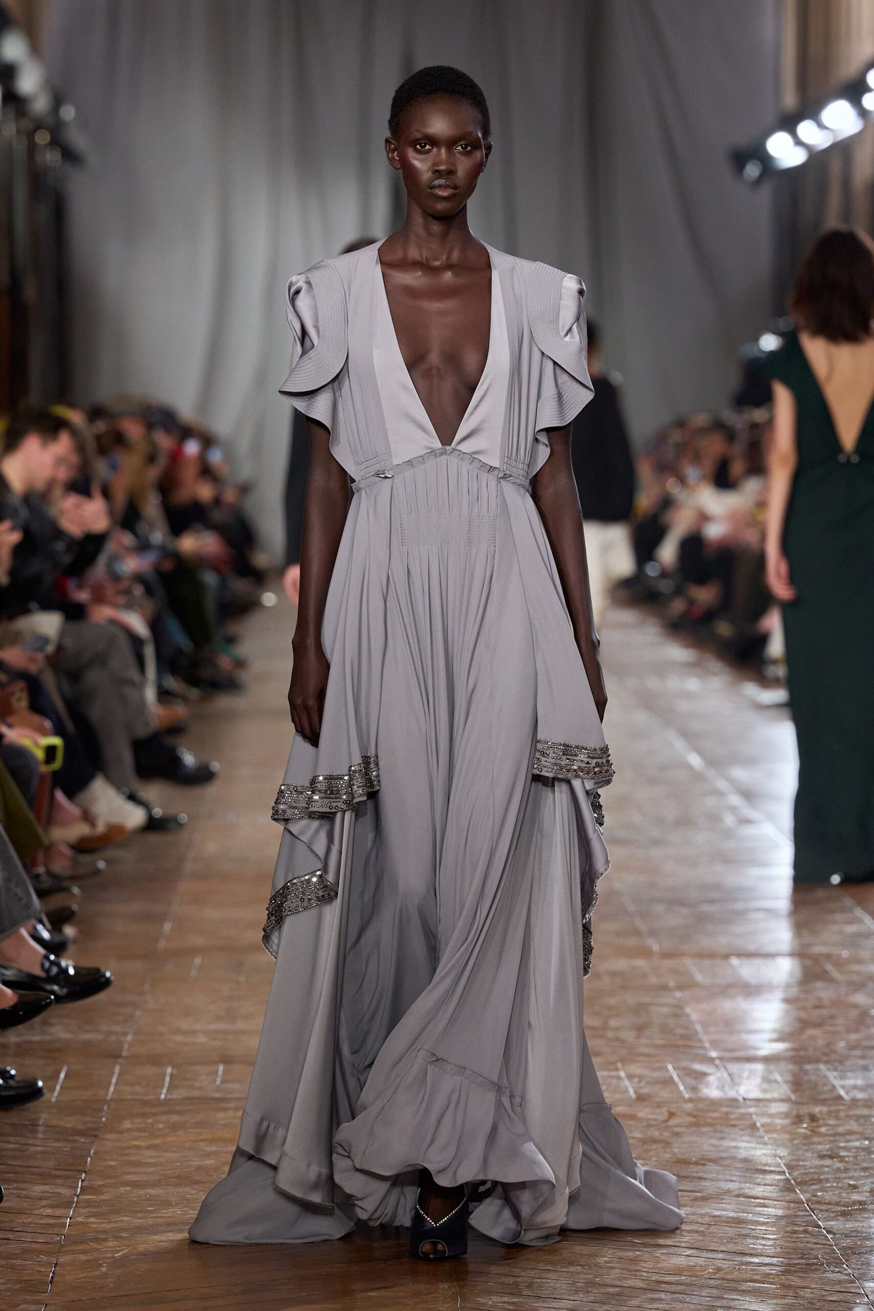 gray silk sleeveless v-neck fitted ruffled layered gown