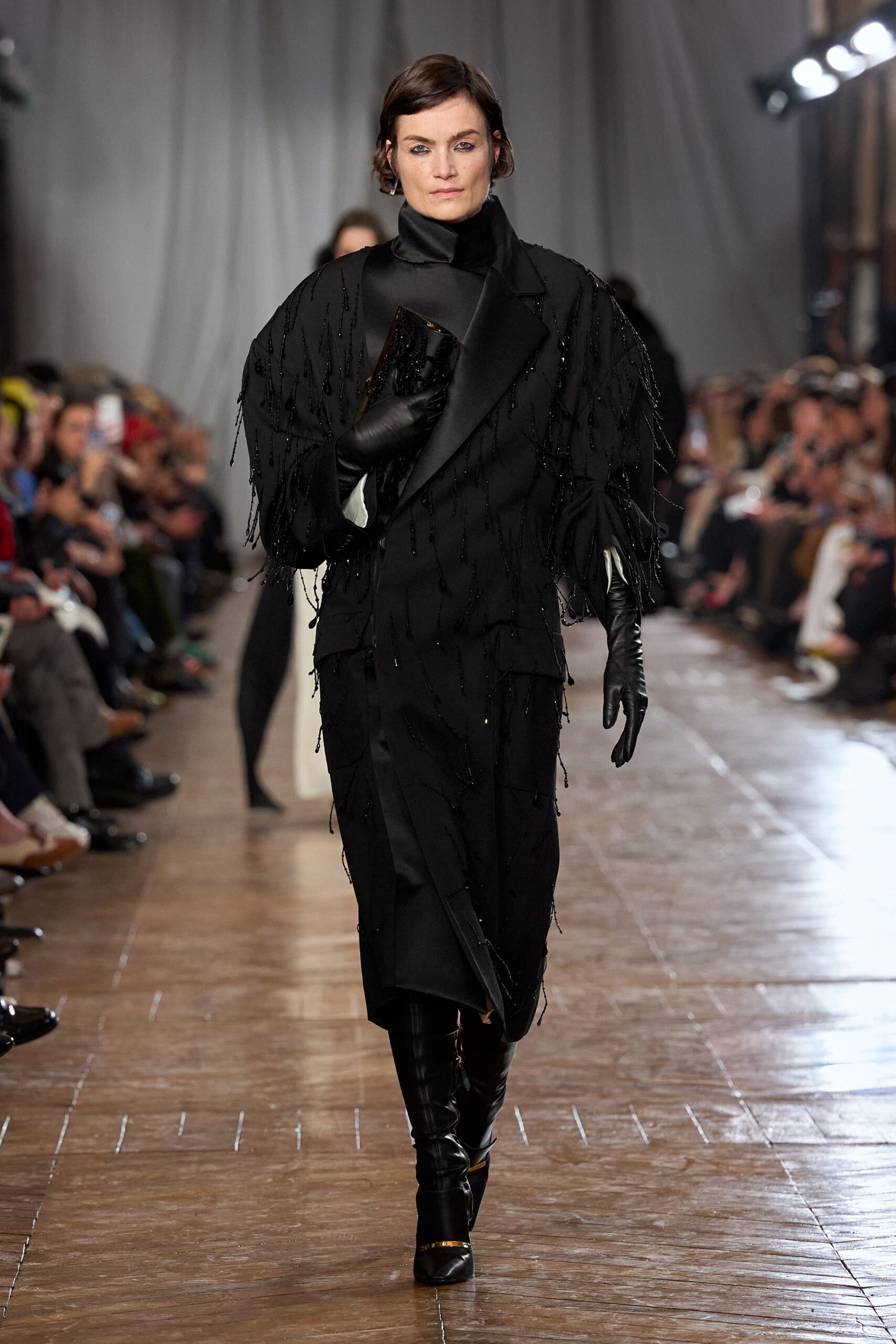 black fitted midi dress with gloves and boots