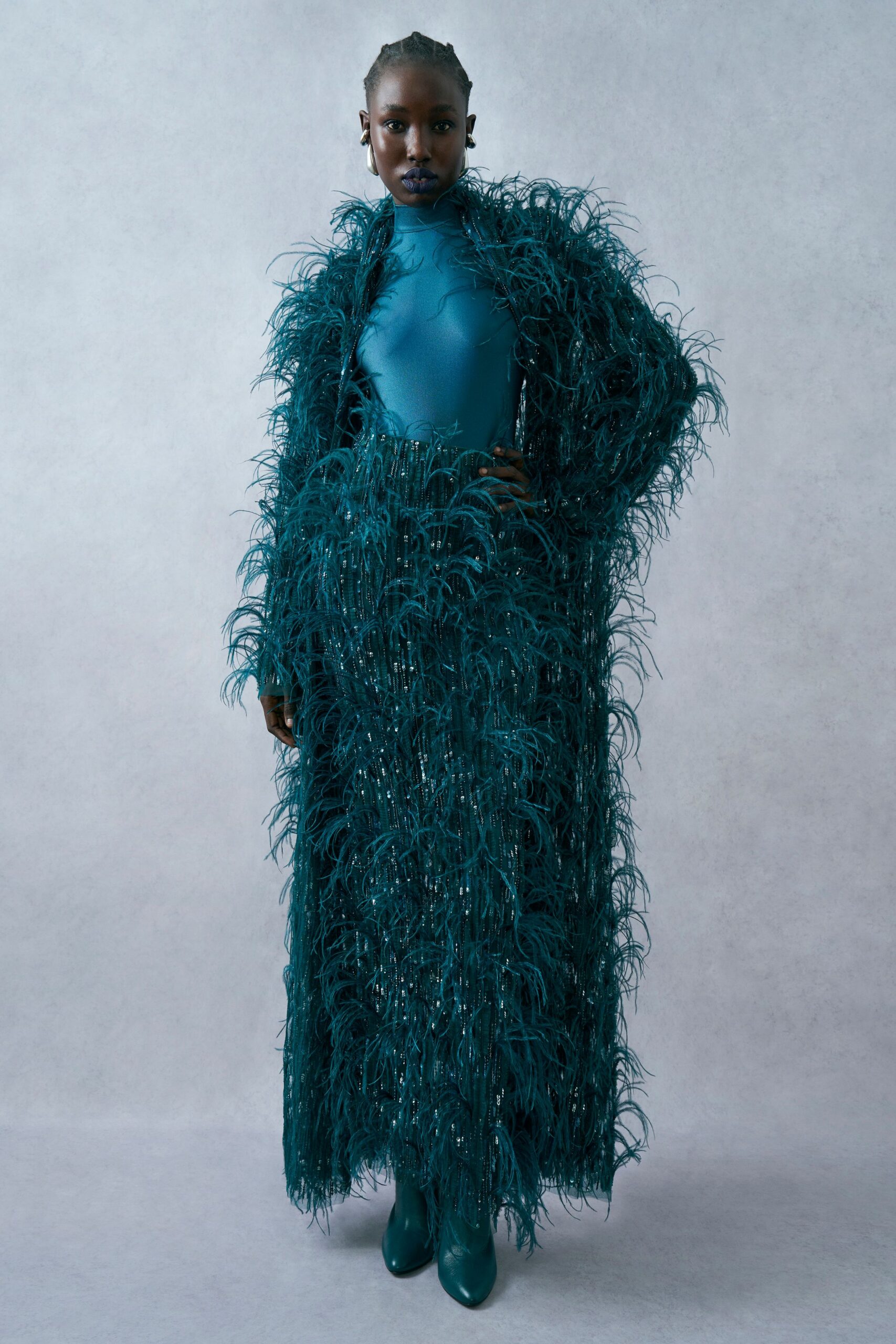 teal feather long-sleeve high-neck fitted layered flowing gown