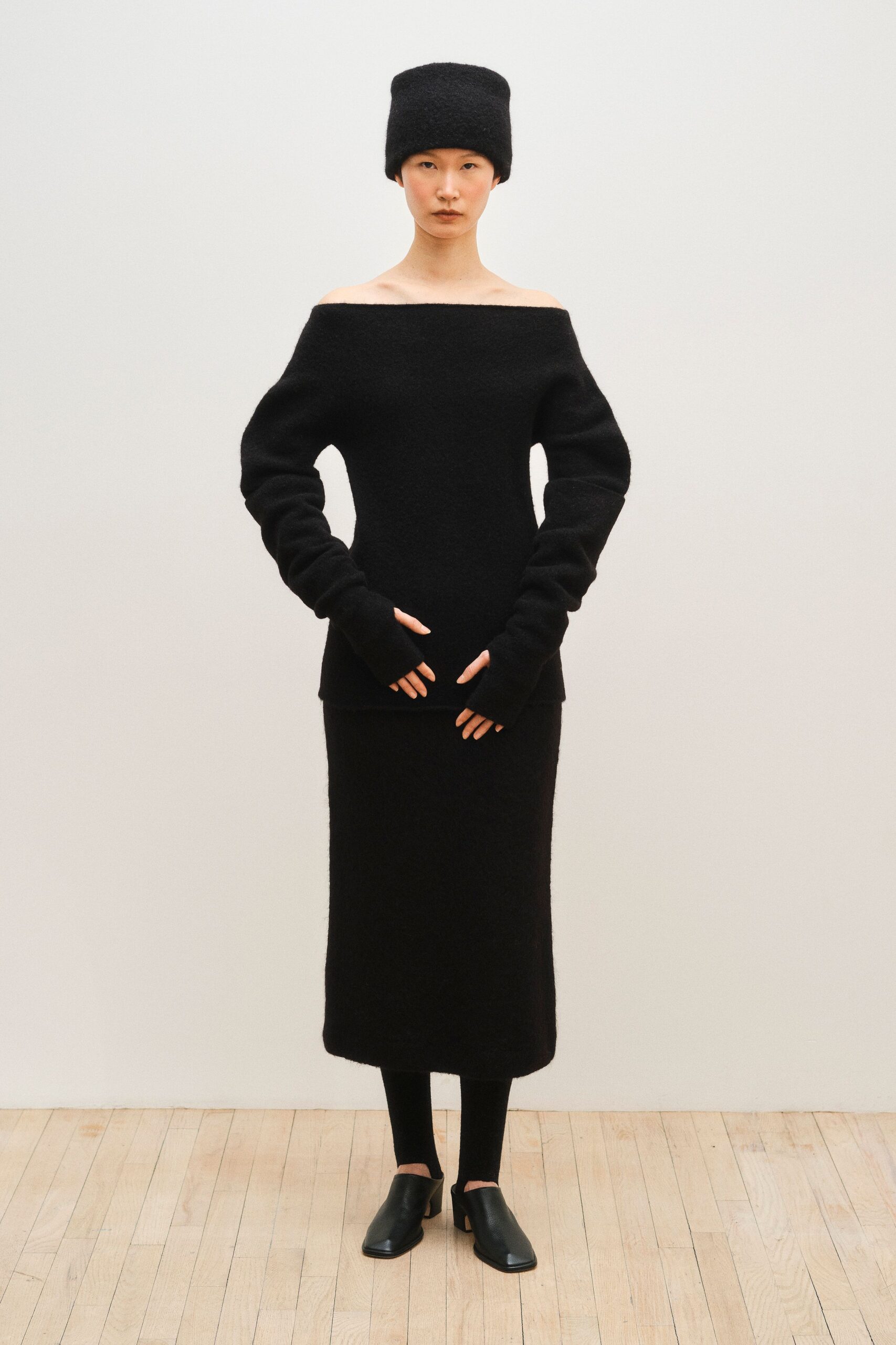 black fitted sweater and midi skirt