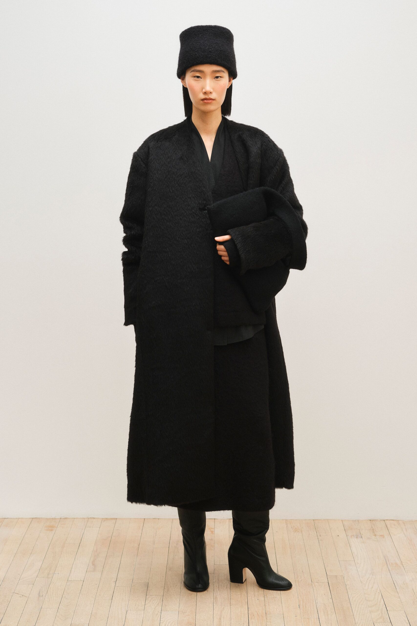 black wool long-sleeve collared oversized textured maxi coat