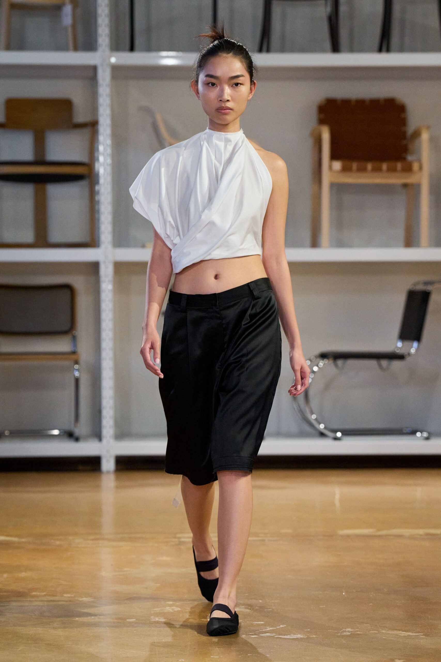 white draped top and black skirt