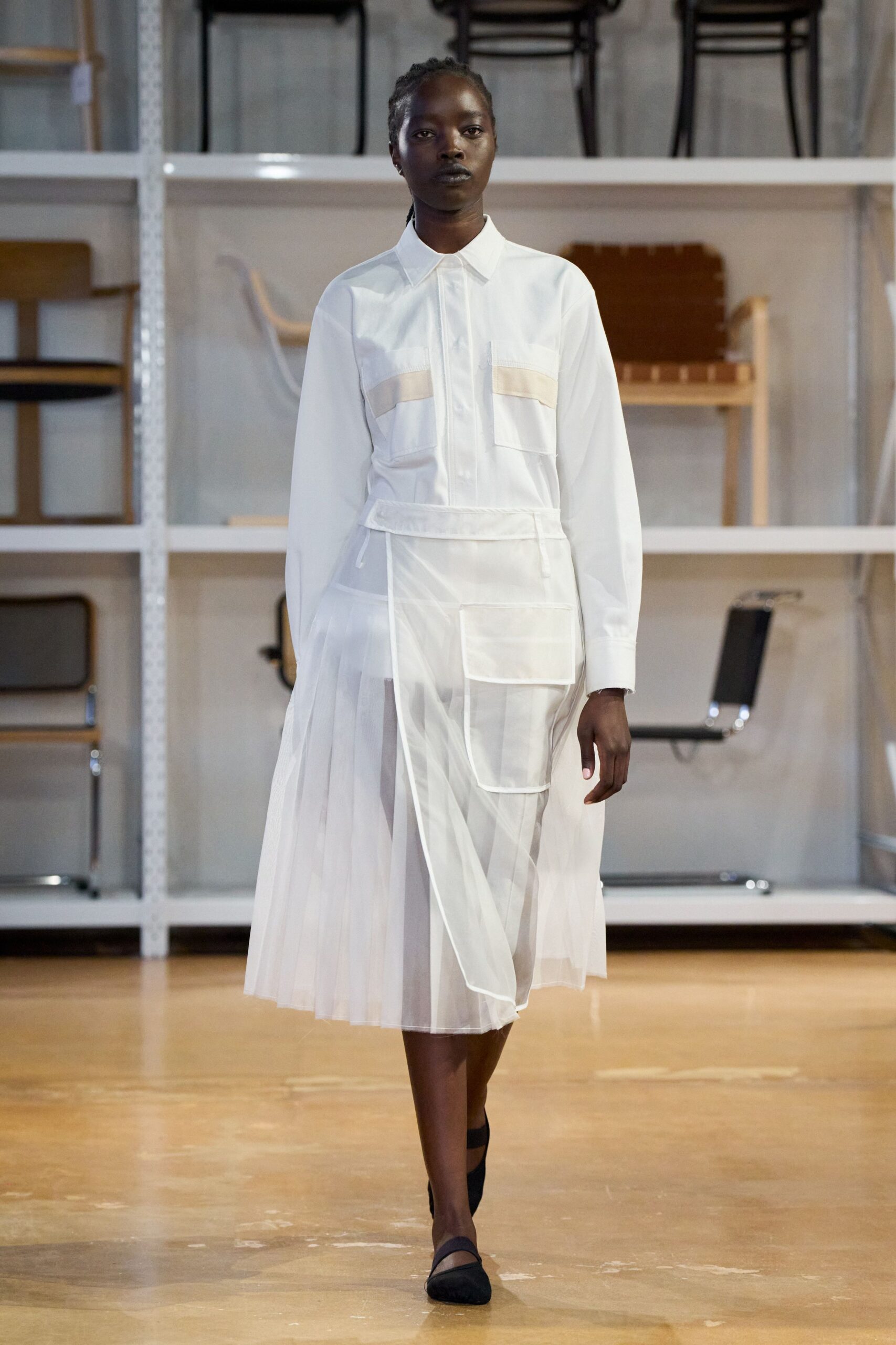 white pleated shirt-dress with black shoes