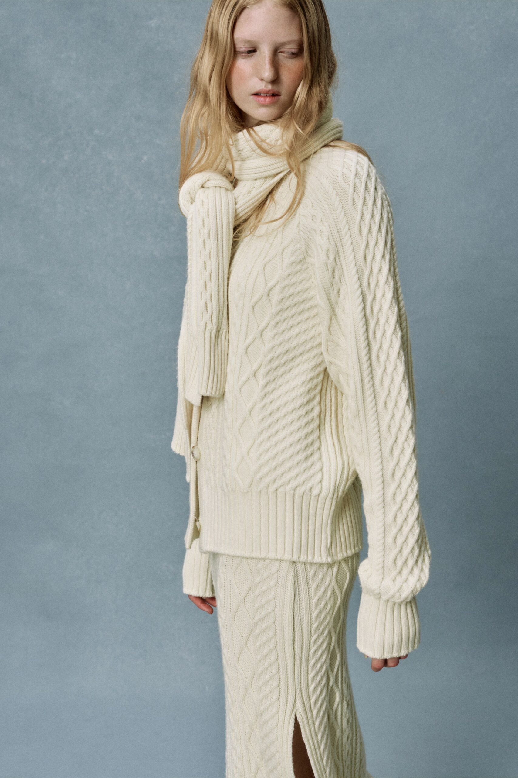 white wool long-sleeve high-neck oversized ribbed draped sweater