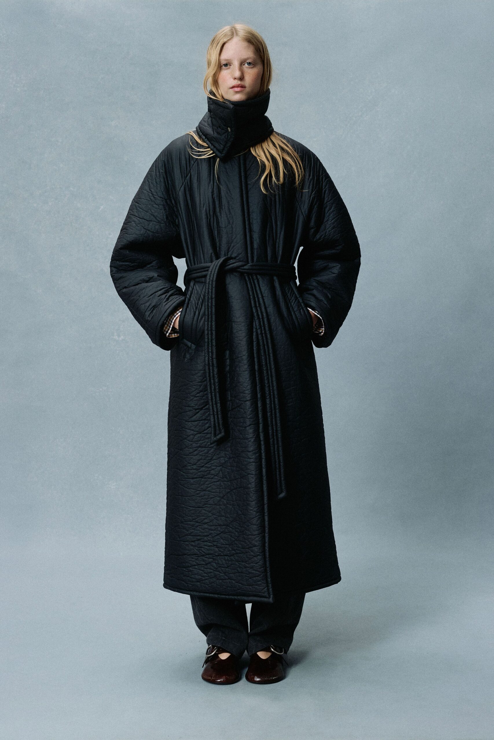 black long-sleeve collared relaxed belted quilted maxi coat