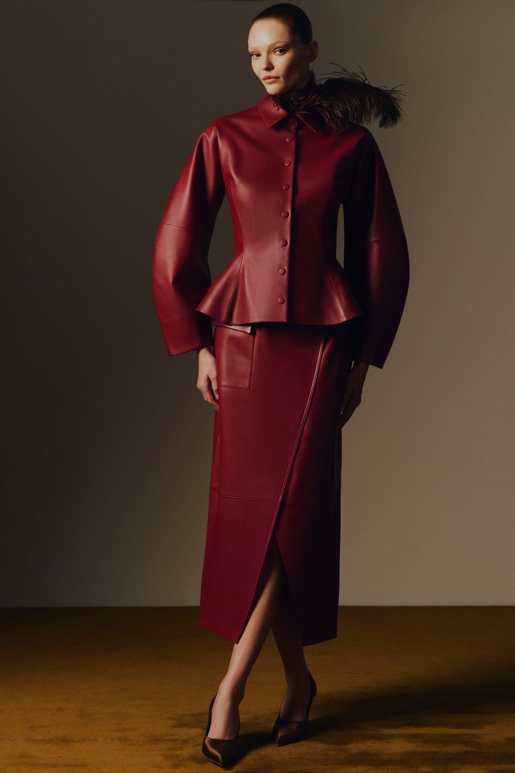red leather long-sleeve collared fitted buttoned flared jacket