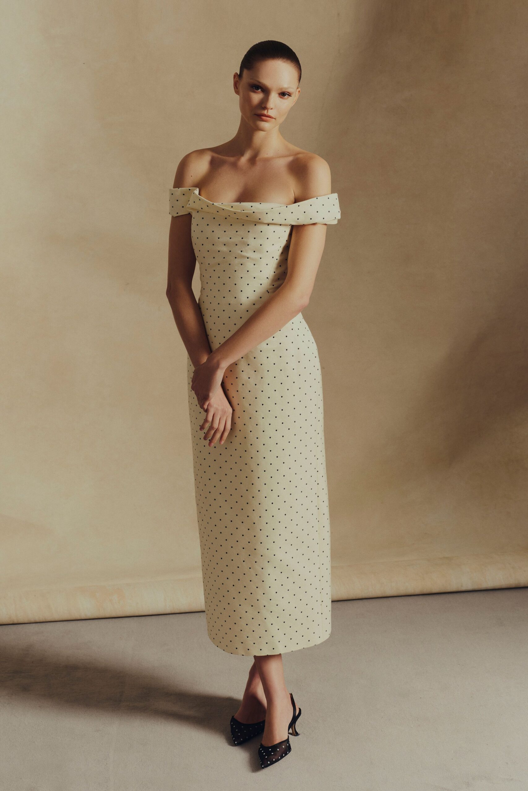 ivory polka-dot off-shoulder gown