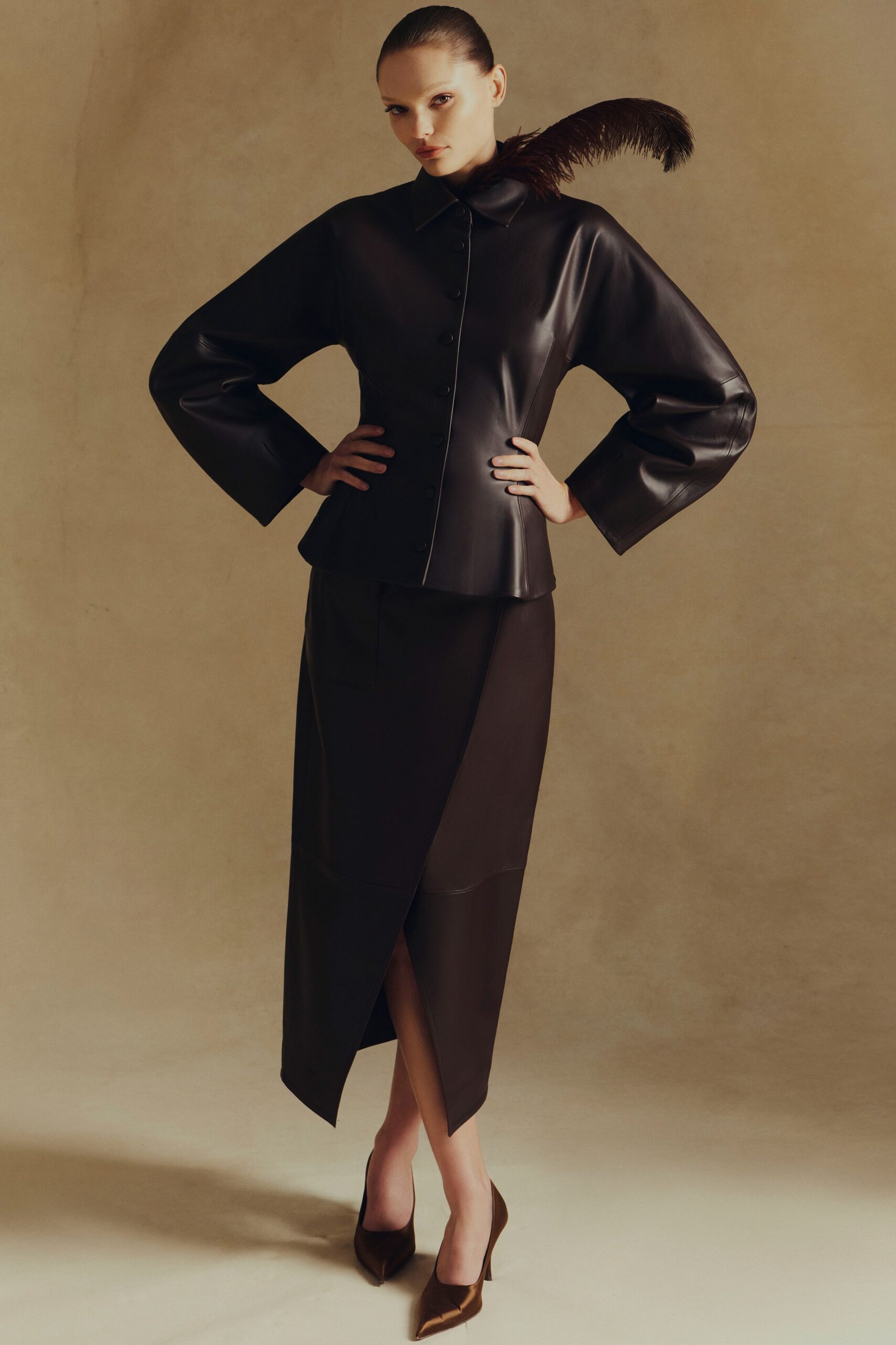 black leather long-sleeve collared fitted buttoned jacket