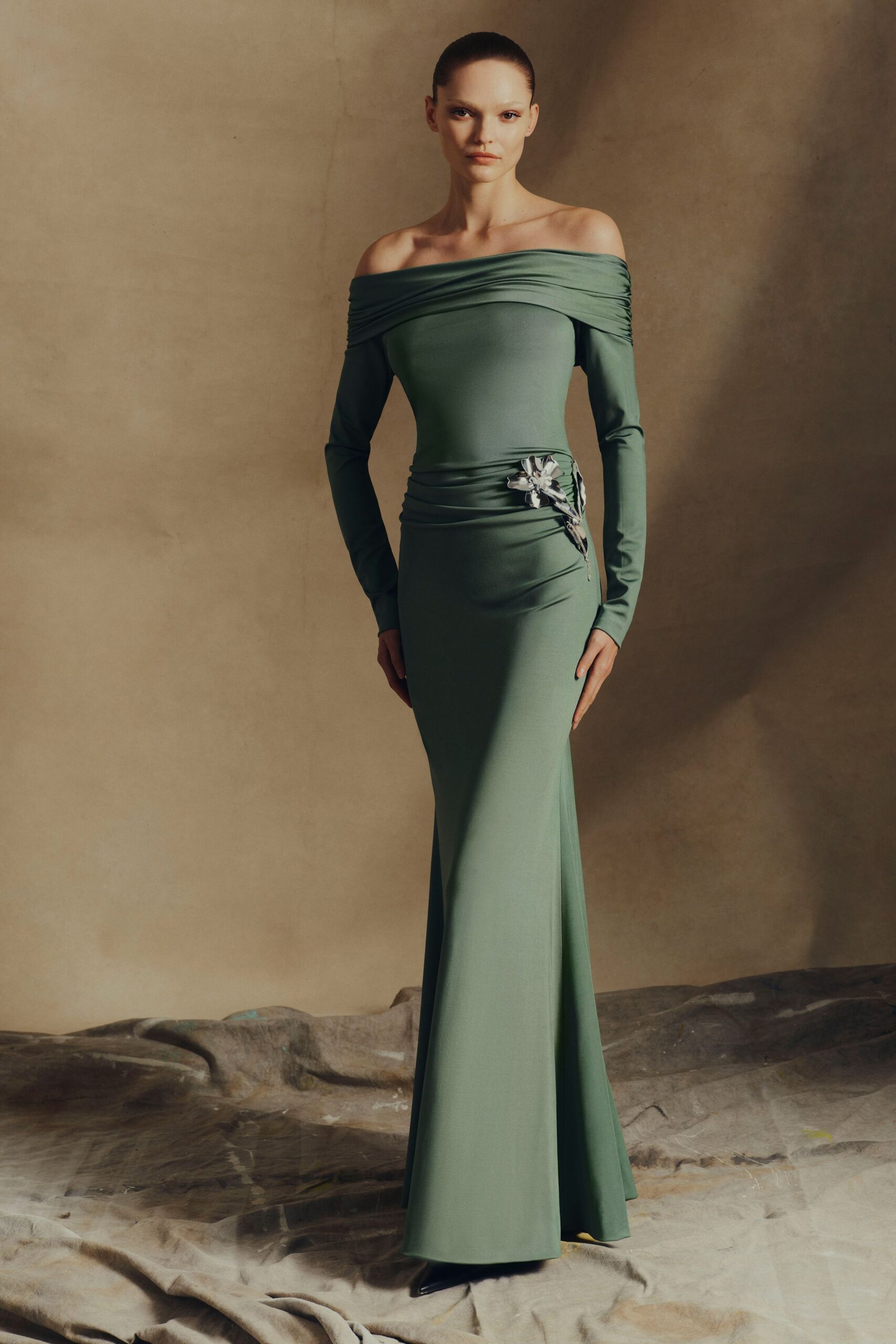 fitted green off-shoulder gown