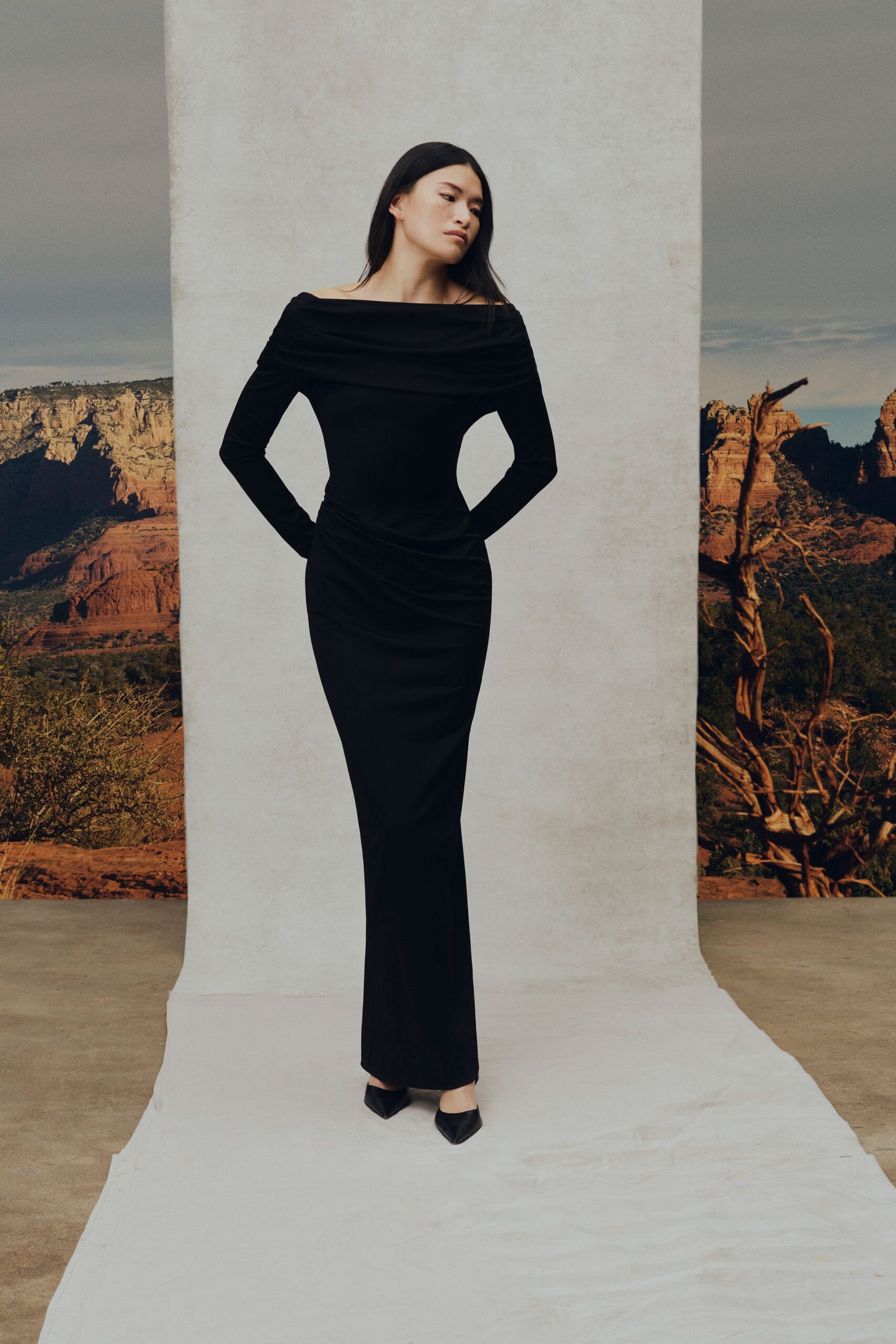 black velvet long-sleeve off-shoulder fitted ruched maxi gown