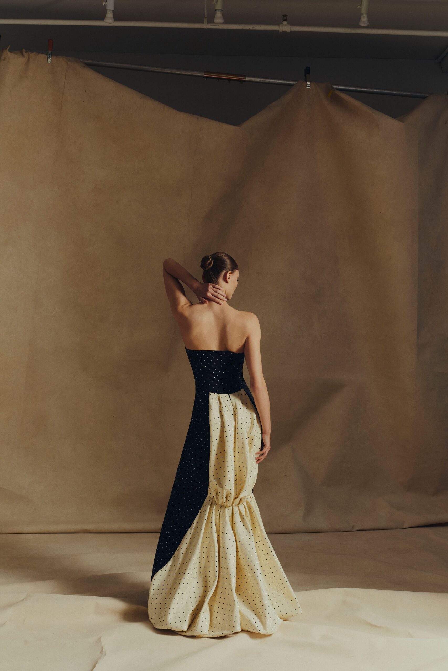 navy and cream strapless gown
