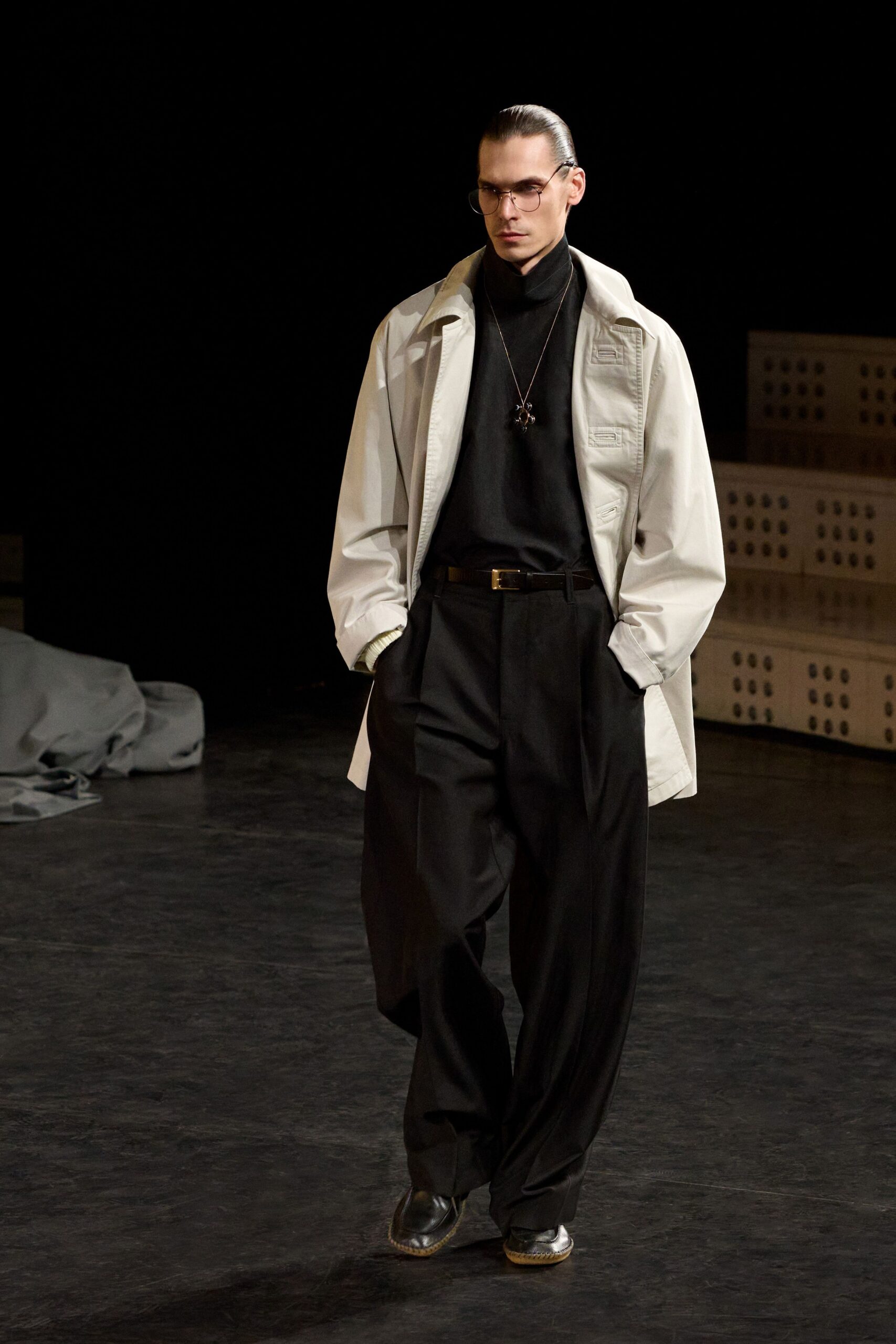 white jacket black turtleneck pants