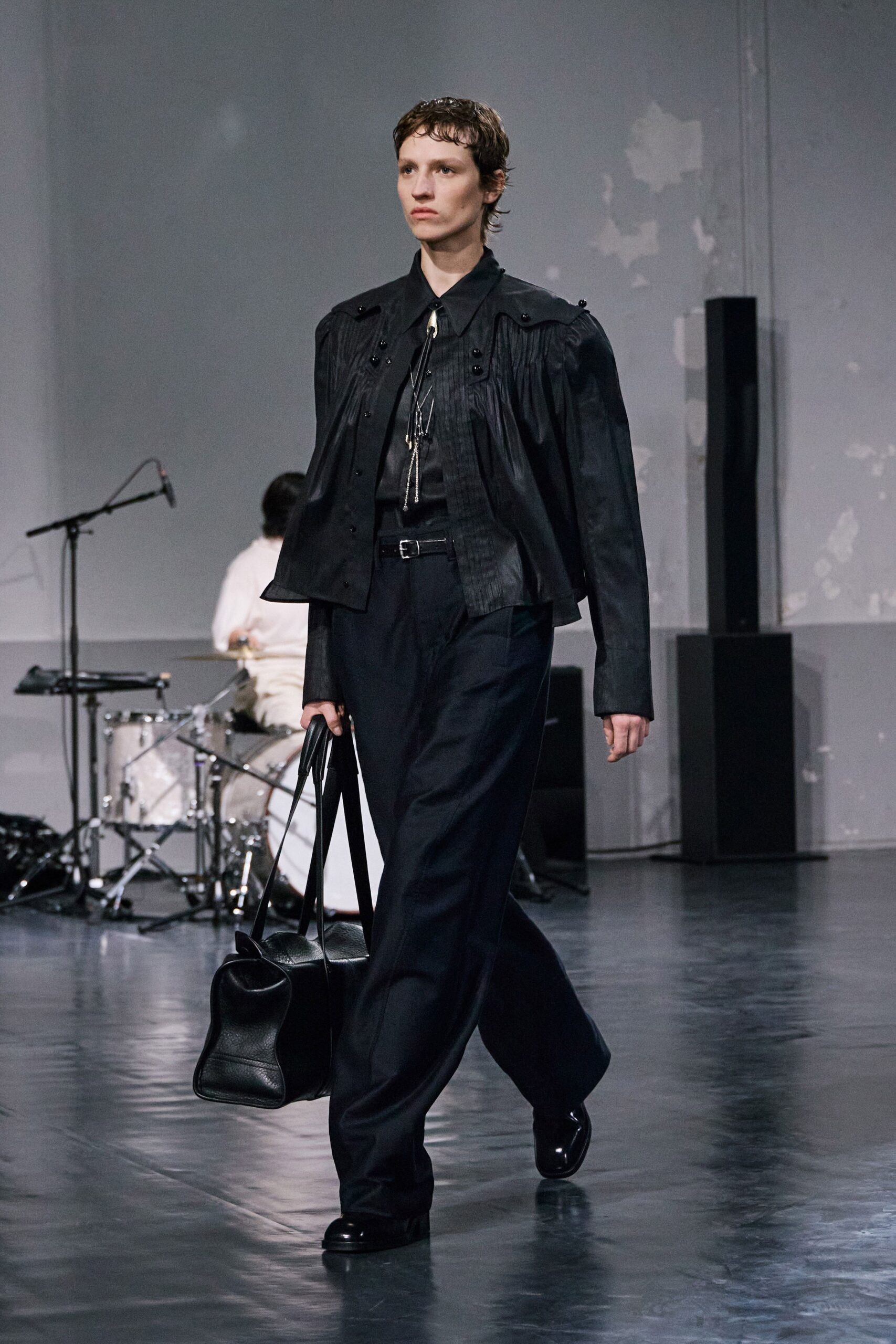 black cotton long-sleeve collared structured pleated jacket
