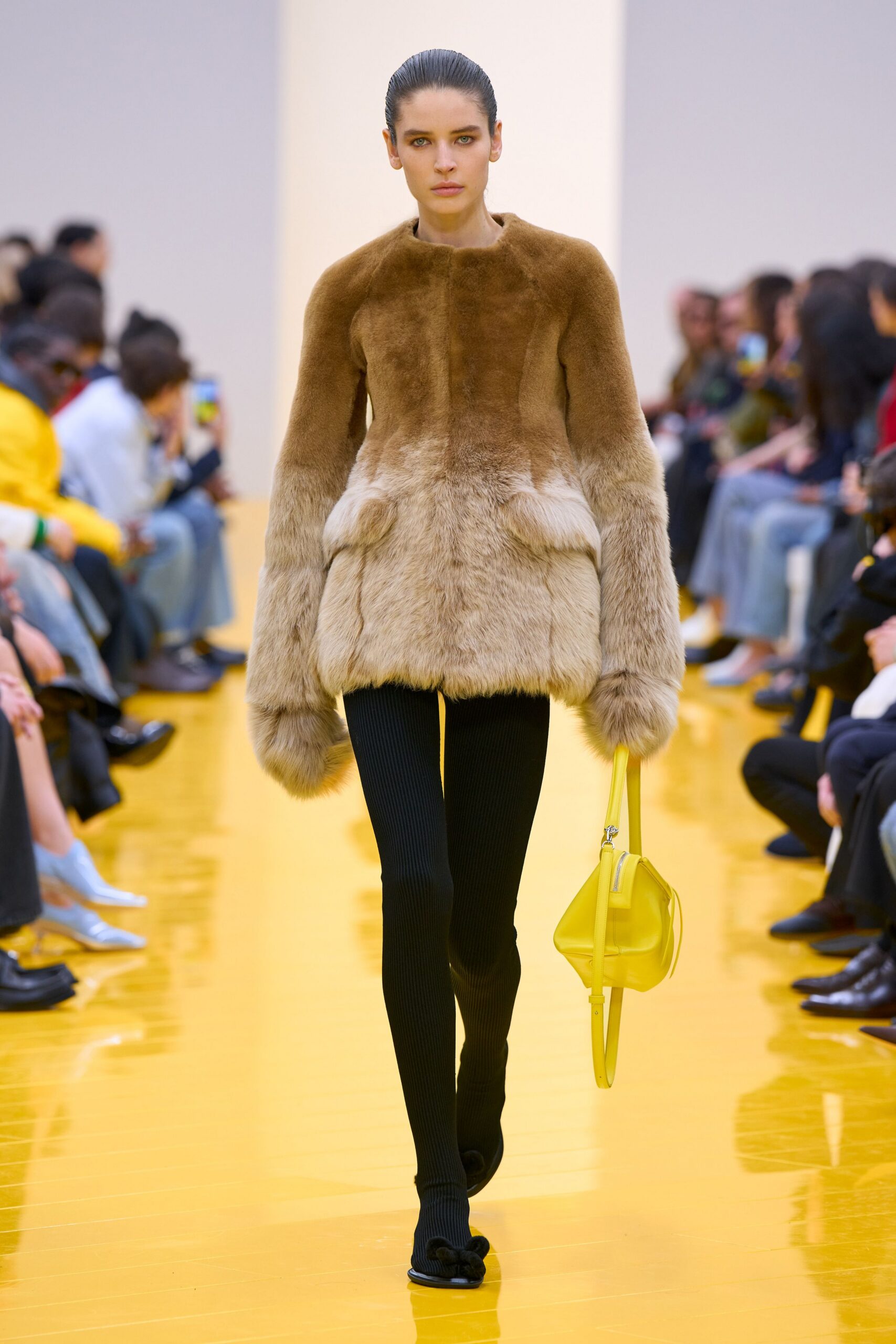 brown fur coat with black pants