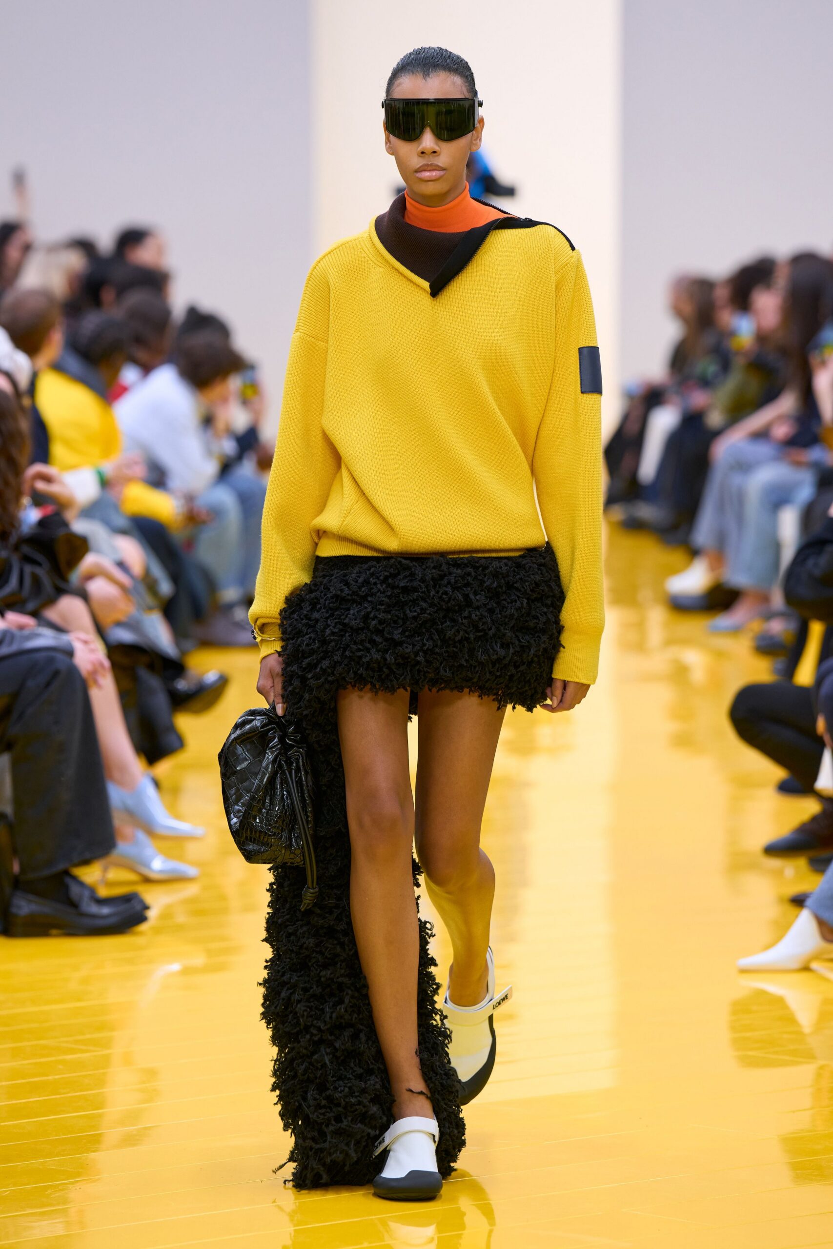 yellow oversized sweater black fringed skirt