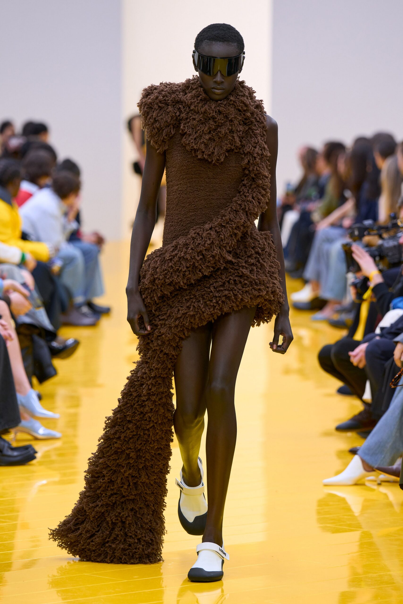 brown ruffled mini dress with sunglasses
