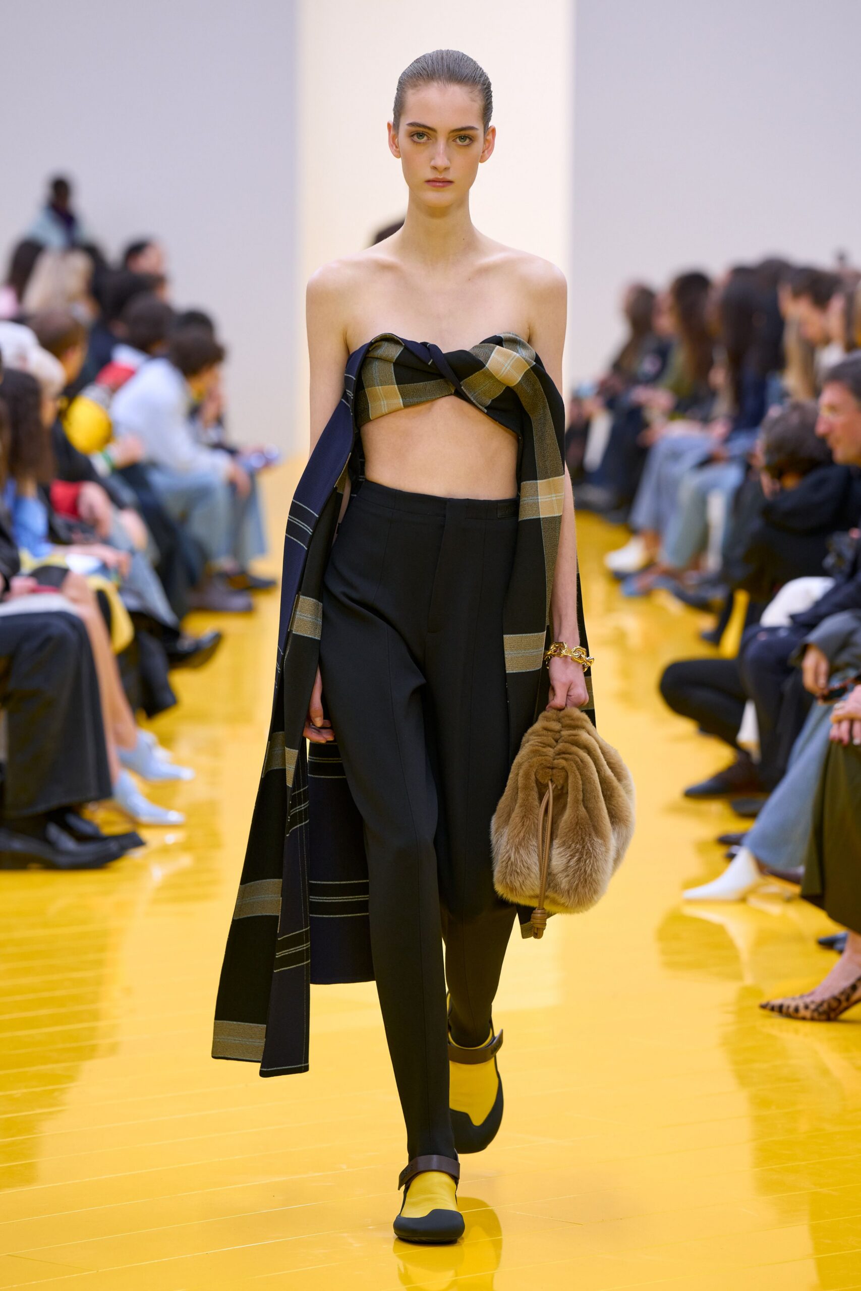 black and green layered top with tailored pants