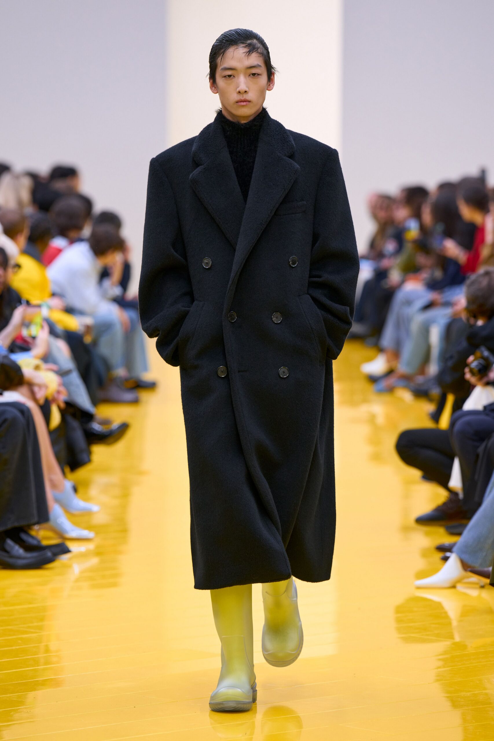 black oversized coat with yellow boots