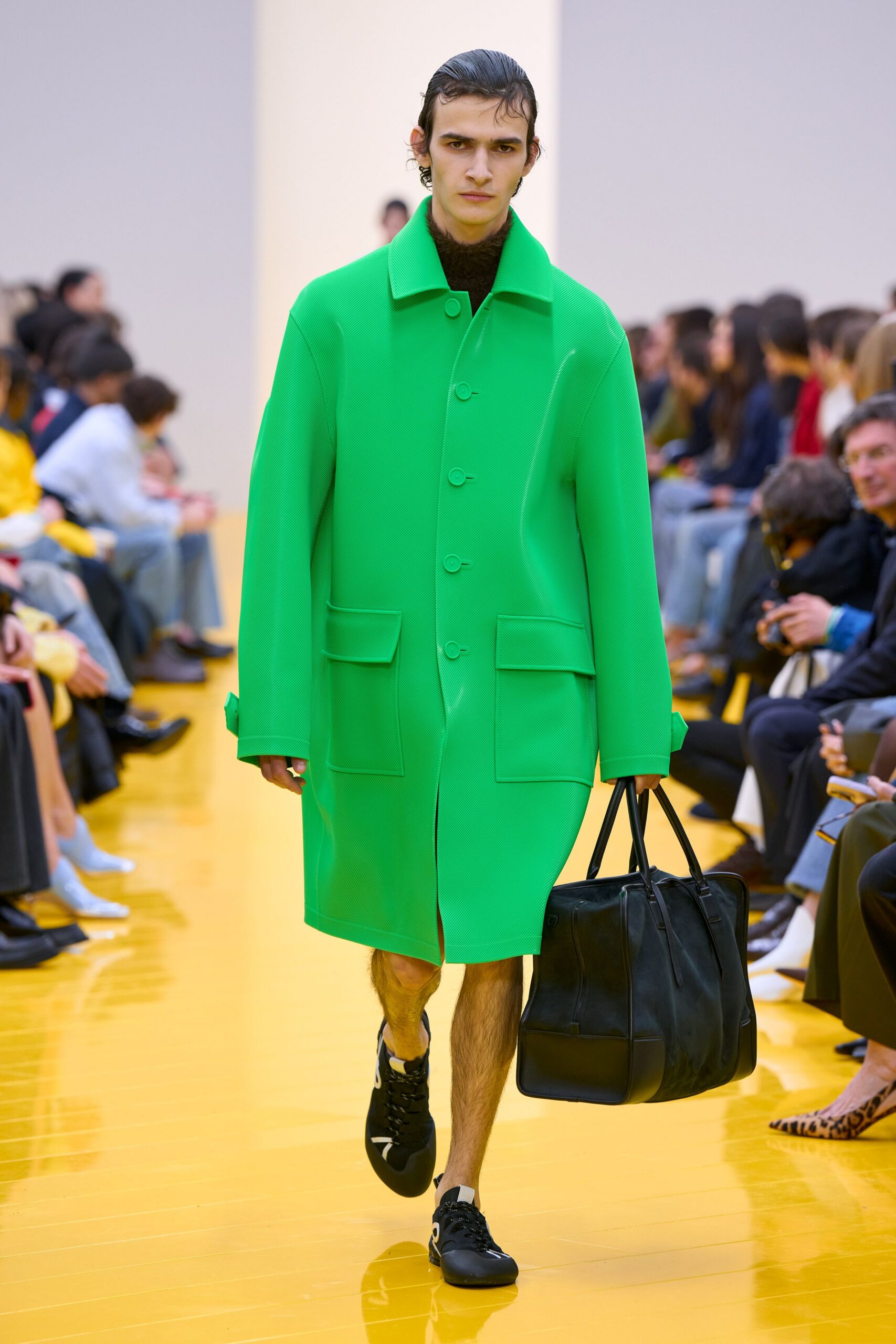 green oversized coat with black accessories