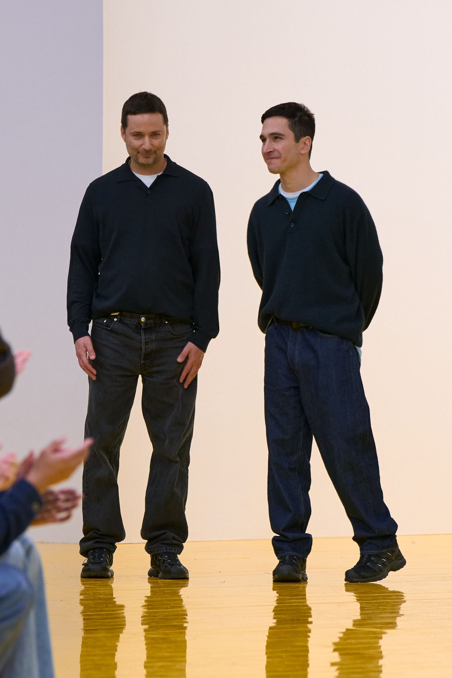 black shirt blue jeans