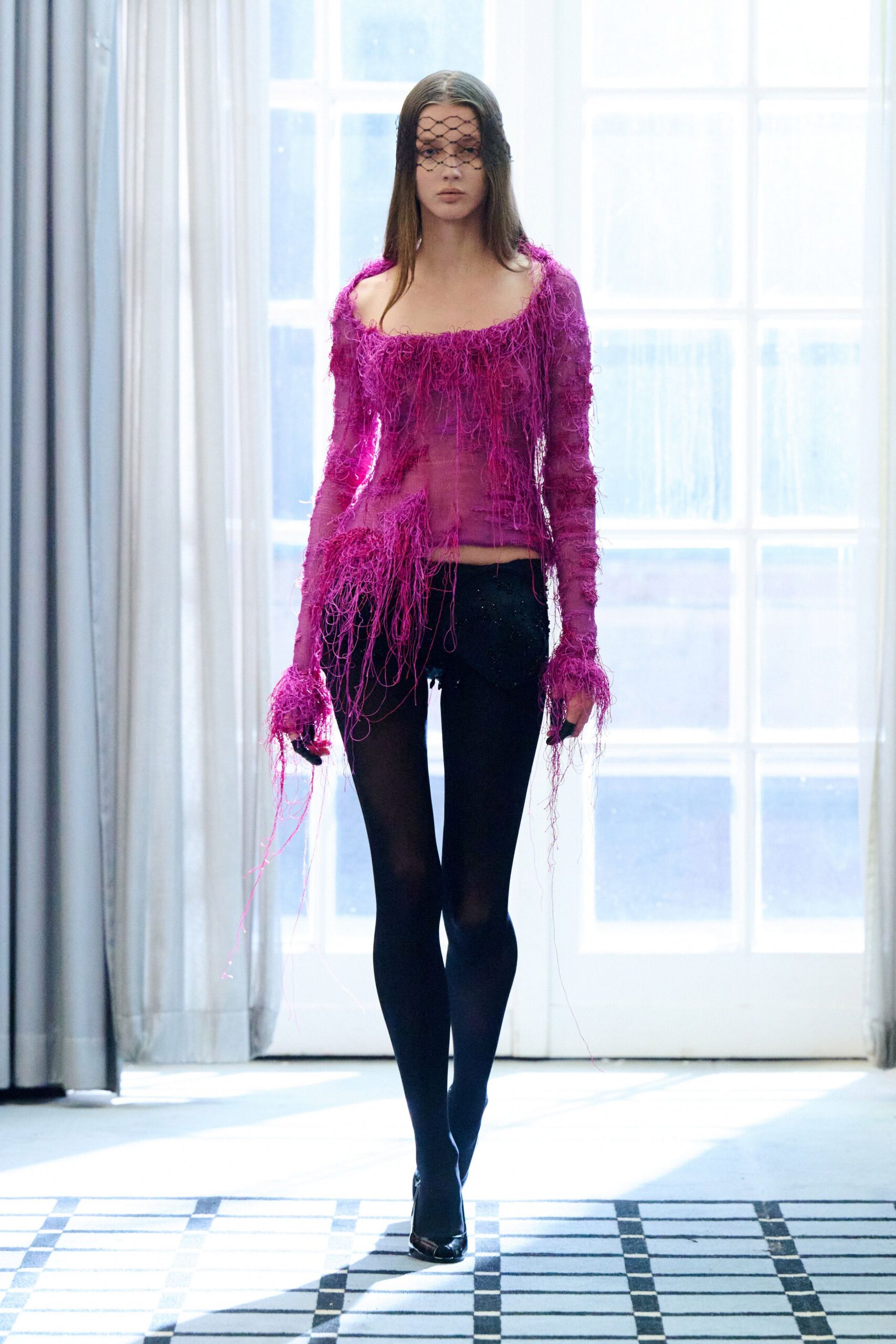 pink fringed top with black shorts