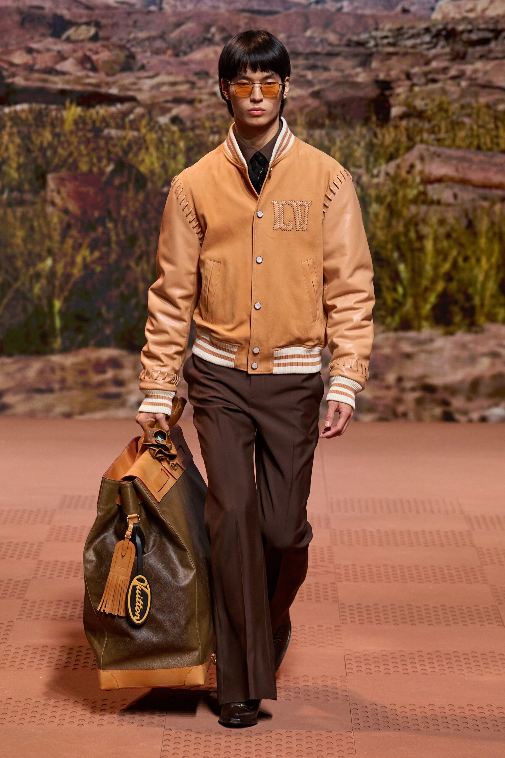 brown leather long-sleeve collared fitted zippered buttoned jacket