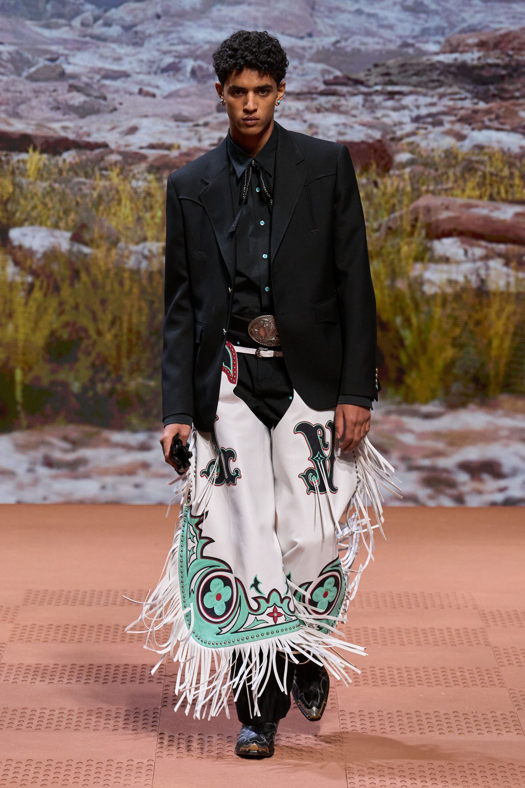 black blazer and white fringed pants