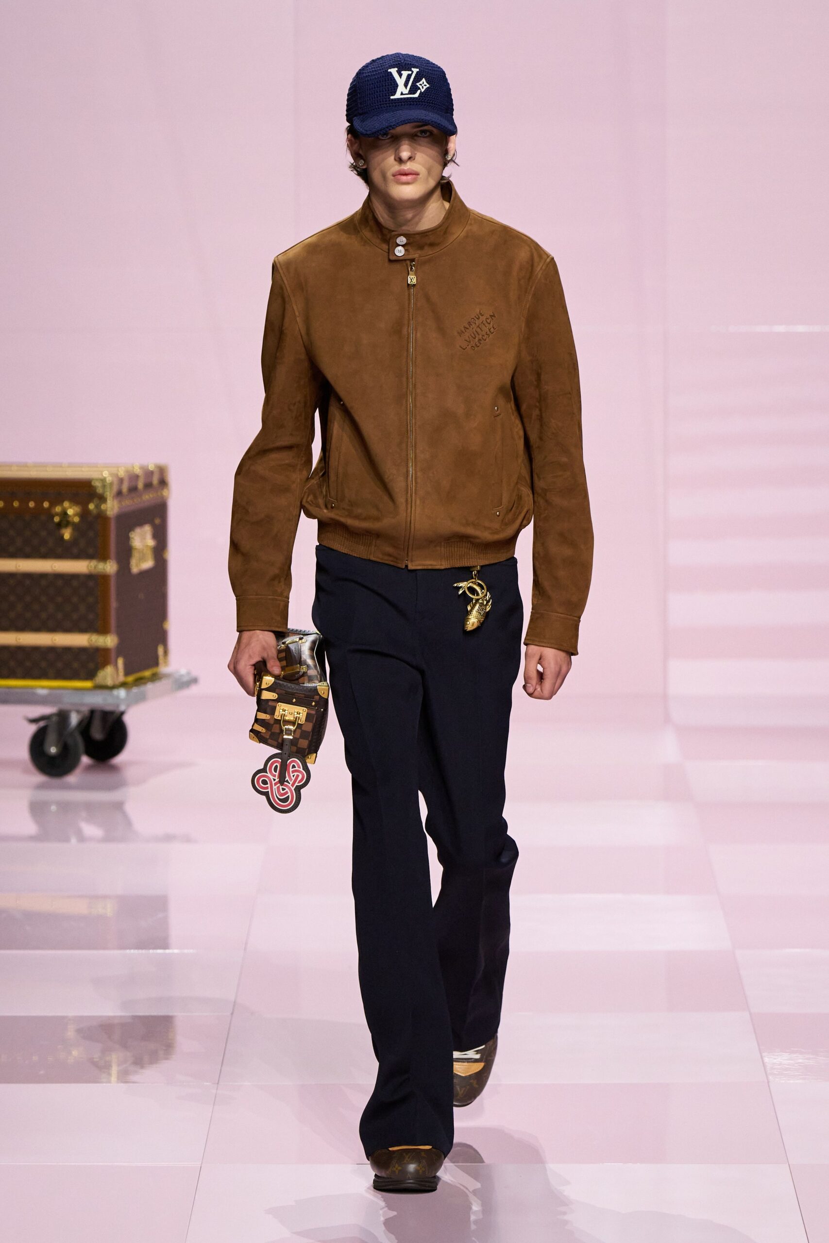 brown leather jacket with black pants