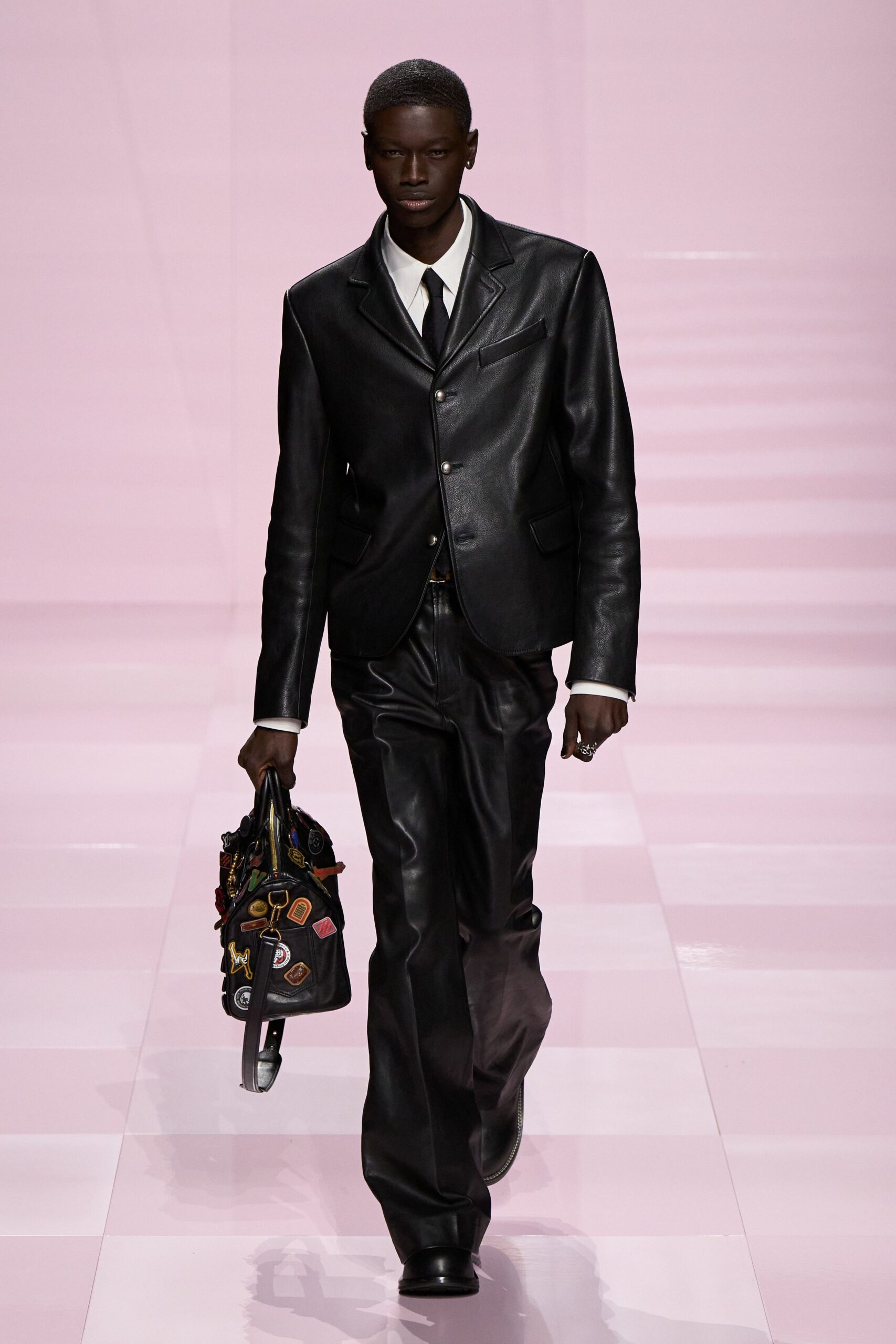 black leather suit with bag