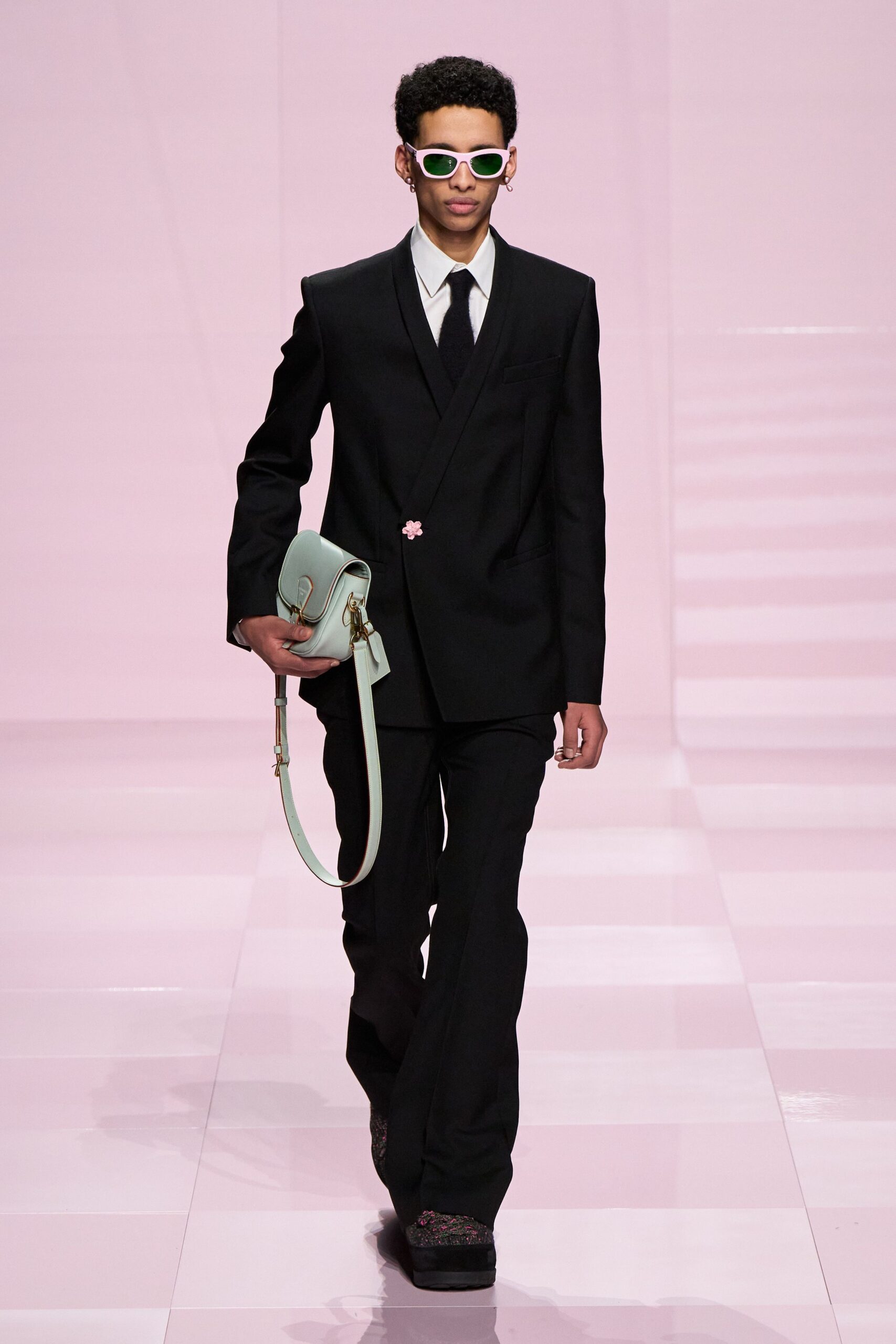 black tailored suit with teal bag