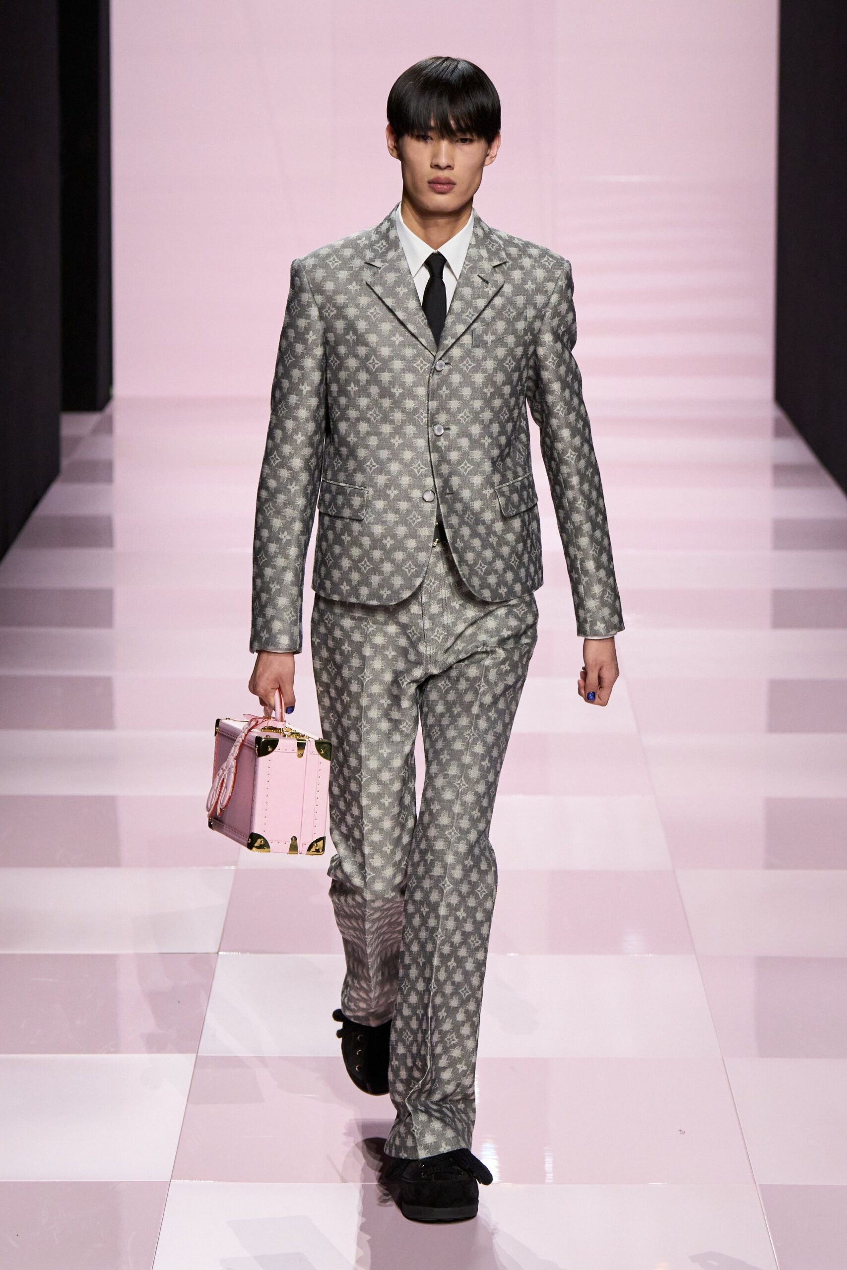 gray tailored suit with pink bag